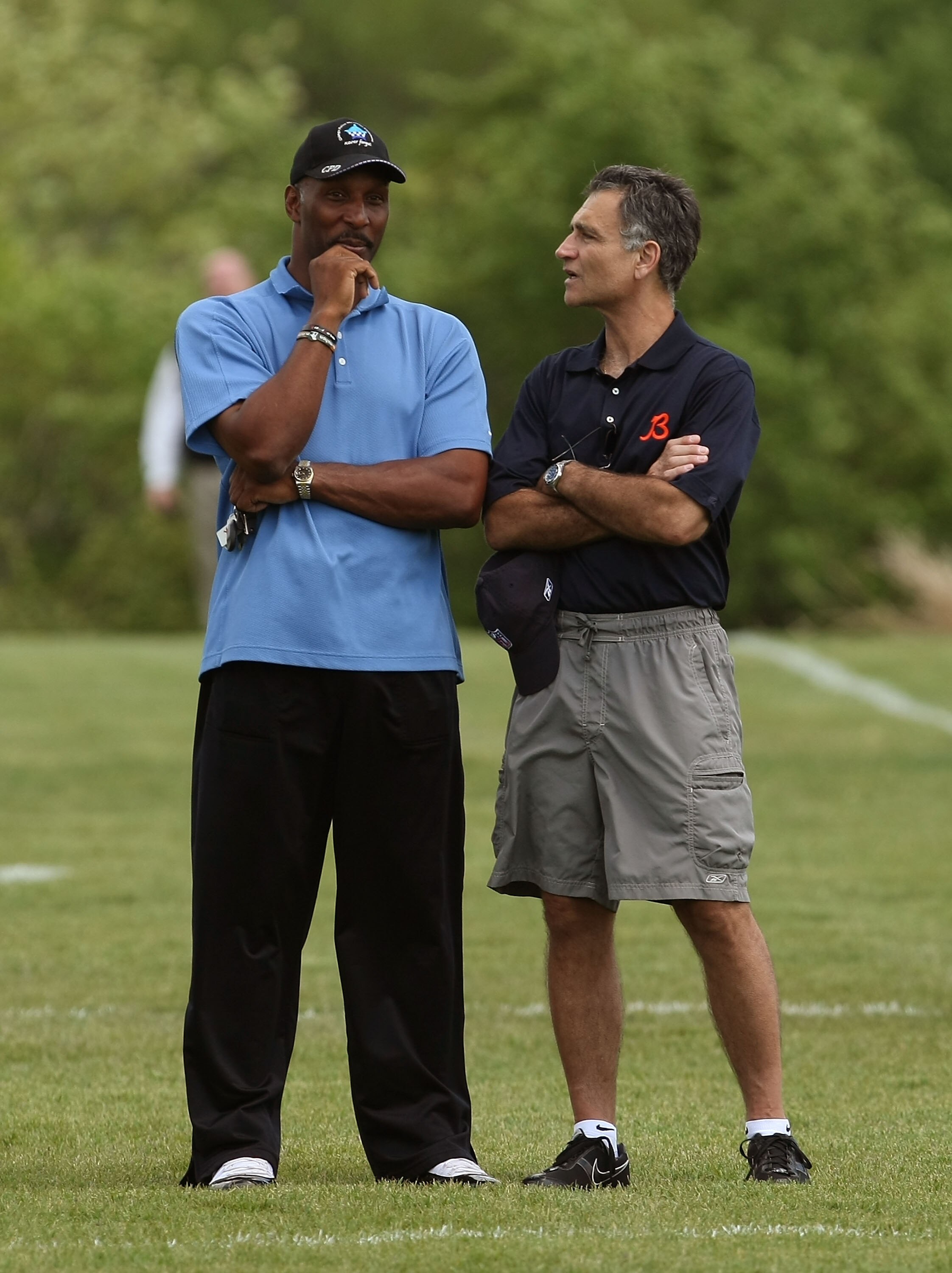 LAKE FOREST, IL - MAY 31: General manager Jerry Angelo of the Chicago Bears (R) talks with former Bear Otis Wilson during a mini-camp practice on May 31, 2008 at Halas Hall in Lake Forest, Illinois. (Photo by Jonathan Daniel/Getty Images)