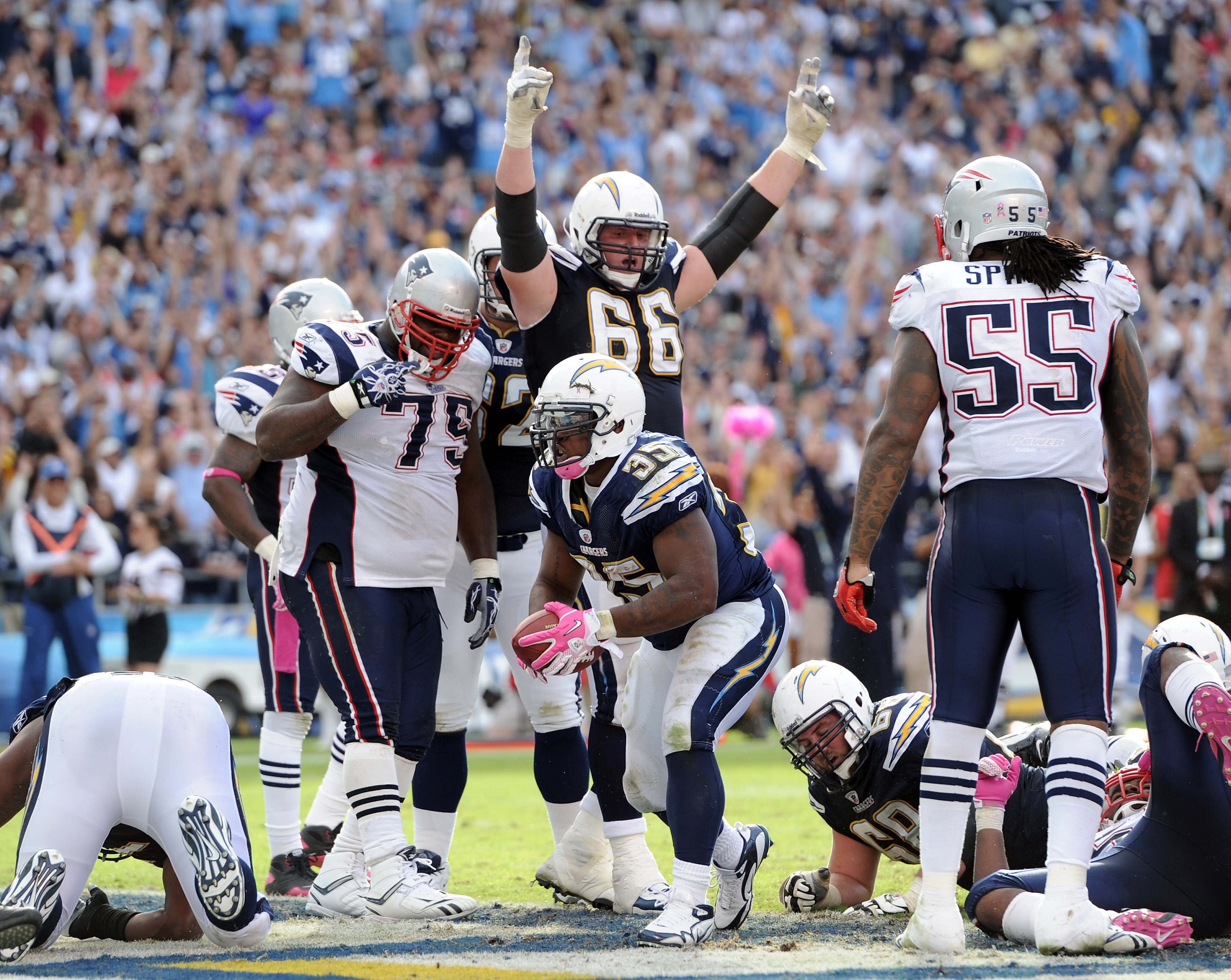 SAN DIEGO - OCTOBER 24:  Mike Tolbert #35 and Jeromey Clary #66 of the the San Diego Chargers react to a touchdown in front of Brandon Spikes #55 and Vince Wilfork #75 of the New England Patriots at Qualcomm Stadium on October 24, 2010 in San Diego, Calif