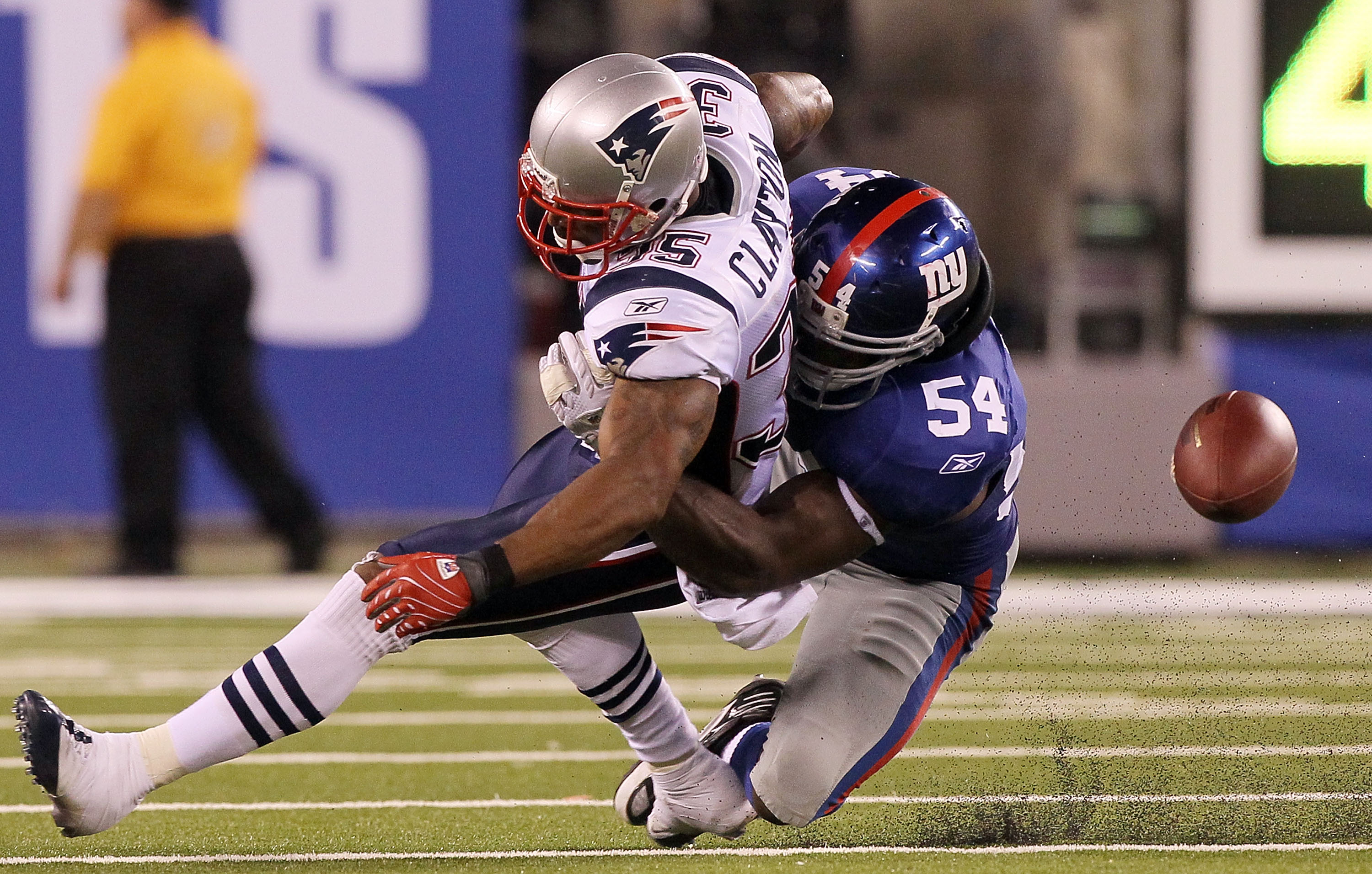 EAST RUTHERFORD, NJ - SEPTEMBER 02:  Thomas Clayton #35 of the New England Patriots can not hold onto a pass as he is defended by Jonathan Goff #54 of the New York Giants on September 2, 2010 at the New Meadowlands Stadium in East Rutherford, New Jersey.