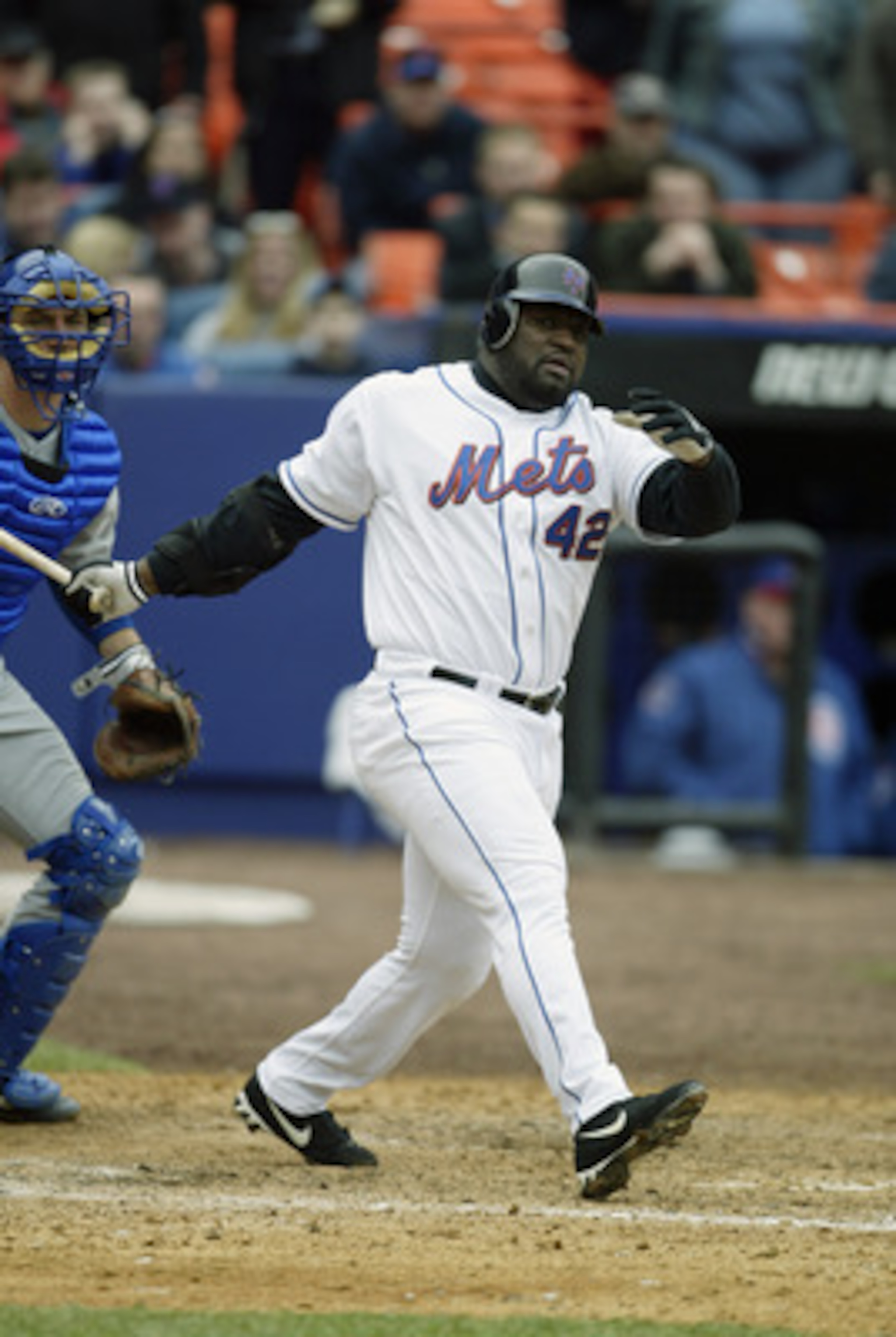 FLUSHING, NY - APRIL 3:  Mo Vaughn #42 of the New York Mets follows through on his swing during the game against the Chicago Cubs at Shea Stadium on April 3, 2003 in Flushing, New York.  The Cubs defeated the Mets 10-9.  (Photo by Al Bello/Getty Images)