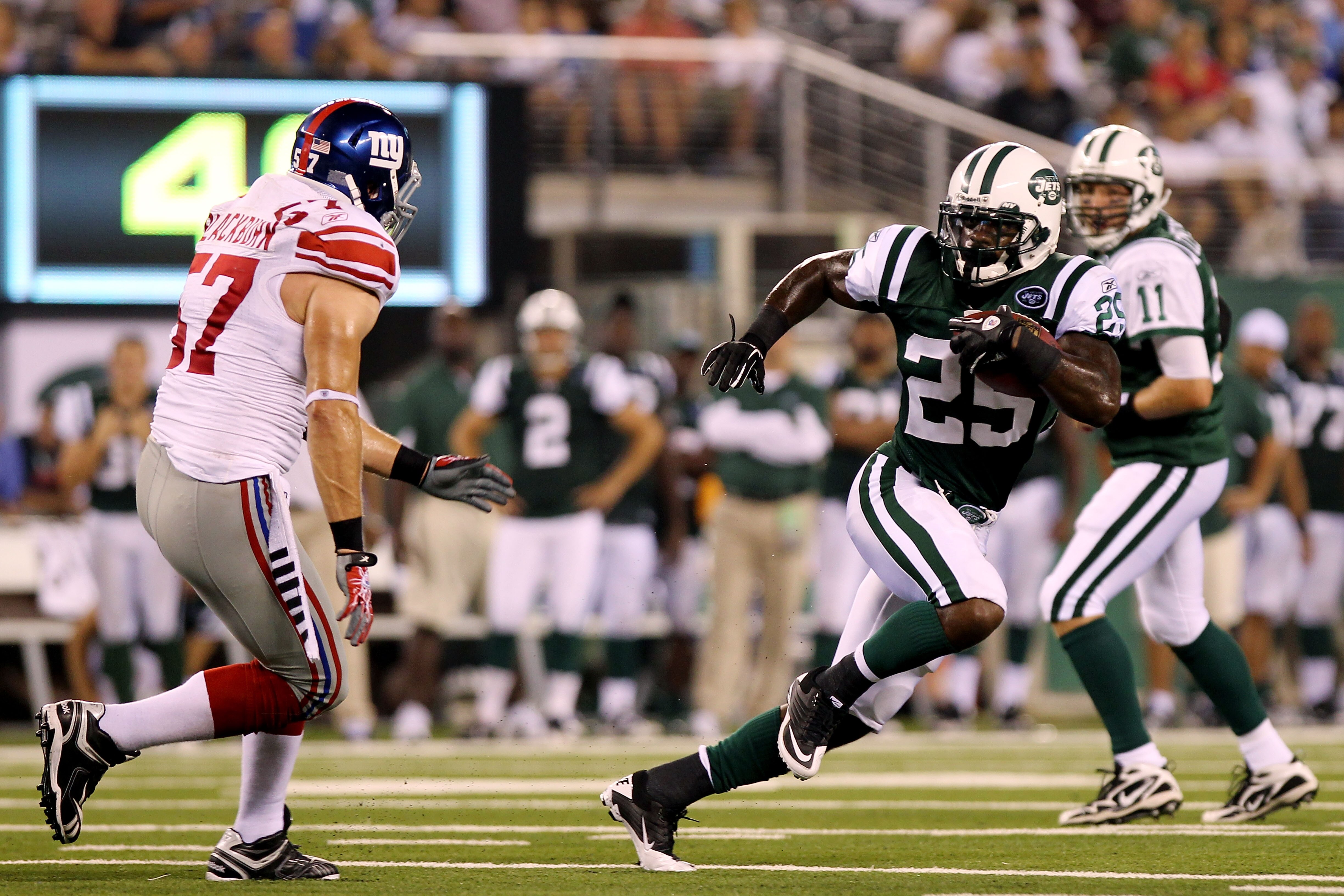 EAST RUTHERFORD, NJ - AUGUST 16:  Joe McKnight #25 of the New York Jets rushes against the New York Giants during their game at New Meadowlands Stadium on August 16, 2010 in East Rutherford, New Jersey.  (Photo by Nick Laham/Getty Images)