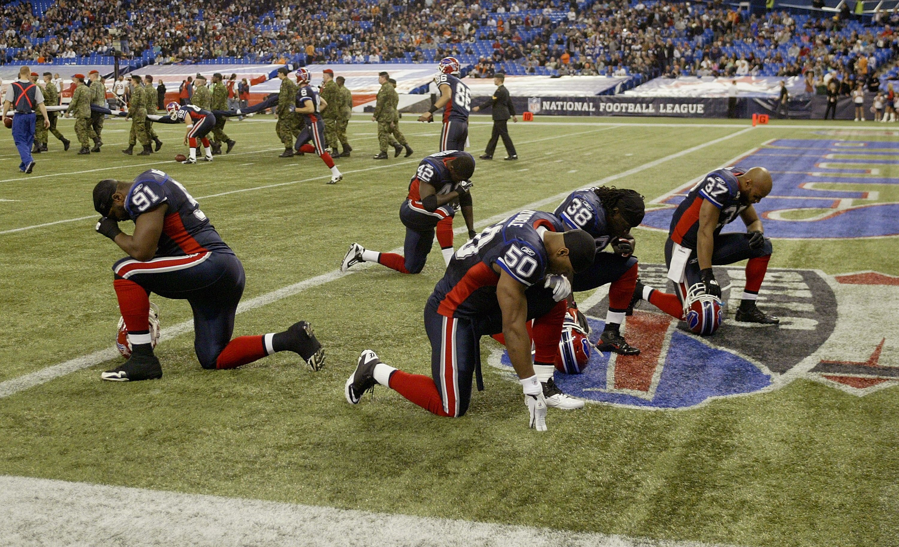 TORONTO, ON - NOVEMBER 07: Members of the Buffalo Bills pray prior to playing against the Chicago Bears at Rogers Centre on November 7, 2010 in Toronto, Canada. Chicago won 22-19.  (Photo by Rick Stewart/Getty Images)