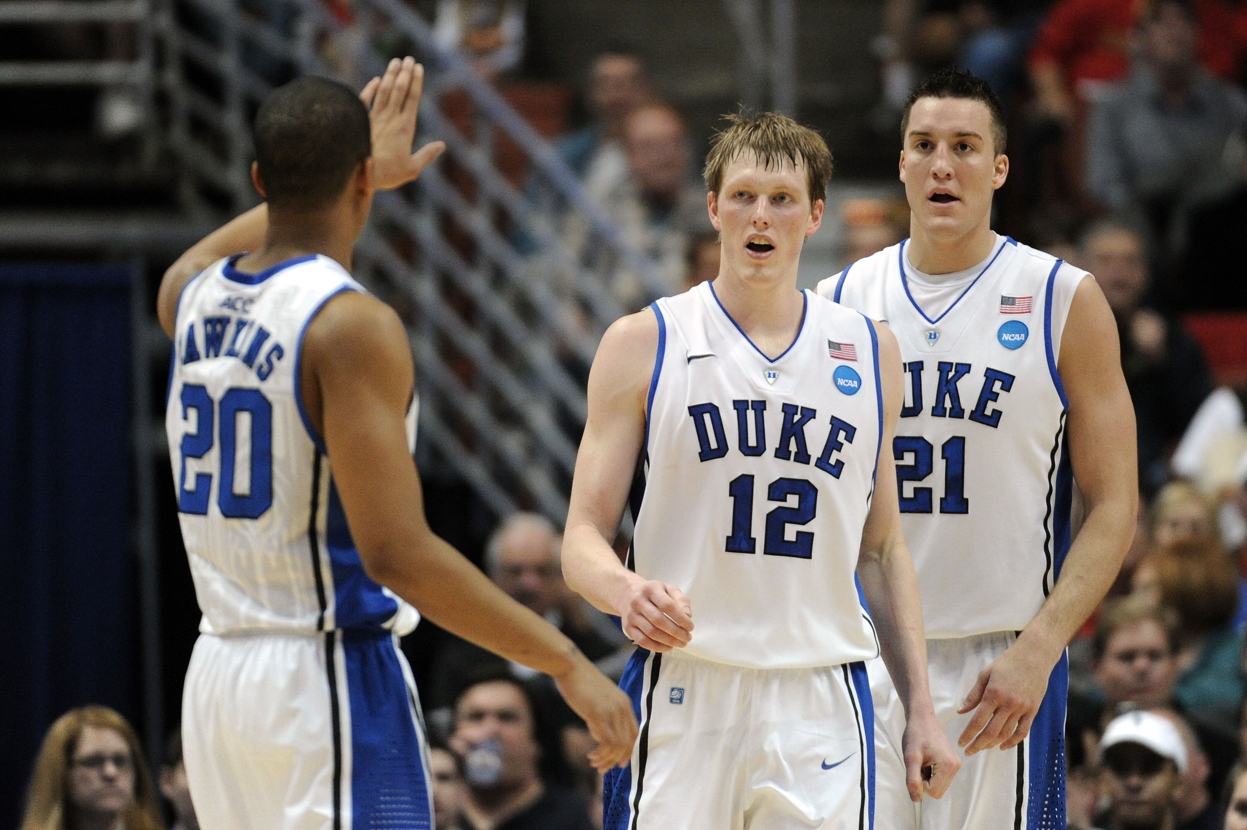 ANAHEIM, CA - MARCH 24:  Andre Dawkins #20, Kyle Singler #12 and Miles Plumlee #21 of the Duke Blue Devils reacts against the Arizona Wildcats during the west regional semifinal of the 2011 NCAA men's basketball tournament at the Honda Center on March 24,