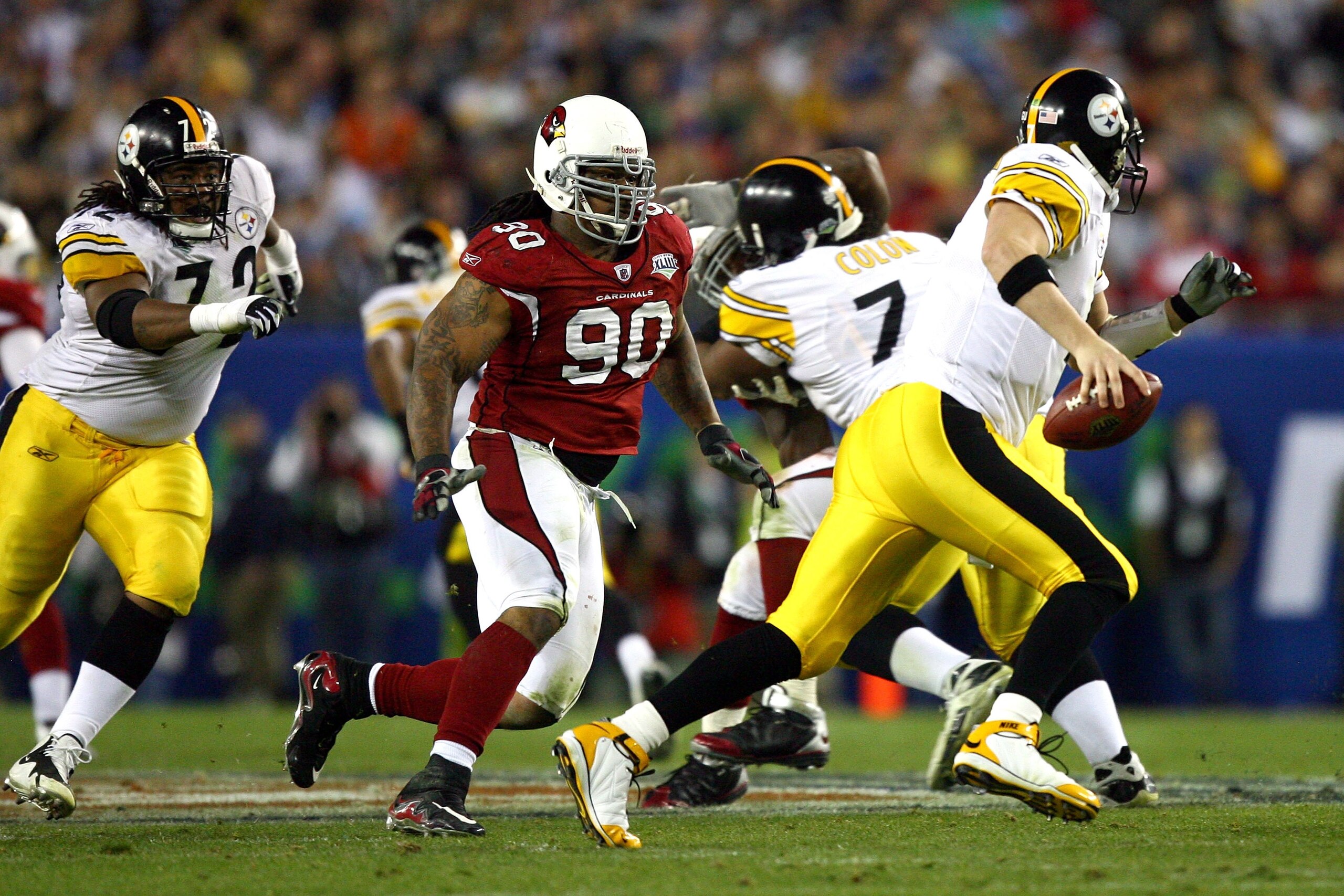 TAMPA, FL - FEBRUARY 01: Darnell Dockett #90 of the Arizona Cardinals pressures quarterback Ben Roethlisberger #7 of the Pittsburgh Steelers past the block of Darnell Stapleton #72 during Super Bowl XLIII on February 1, 2009 at Raymond James Stadium in T TAMPA, FL - FEBRUARY 01: Darnell Dockett #90 of the Arizona Cardinals pressures quarterback Ben Roethlisberger #7 of the Pittsburgh Steelers past the block of Darnell Stapleton #72 during Super Bowl XLIII on February 1, 2009 at Raymond James Stadium in T