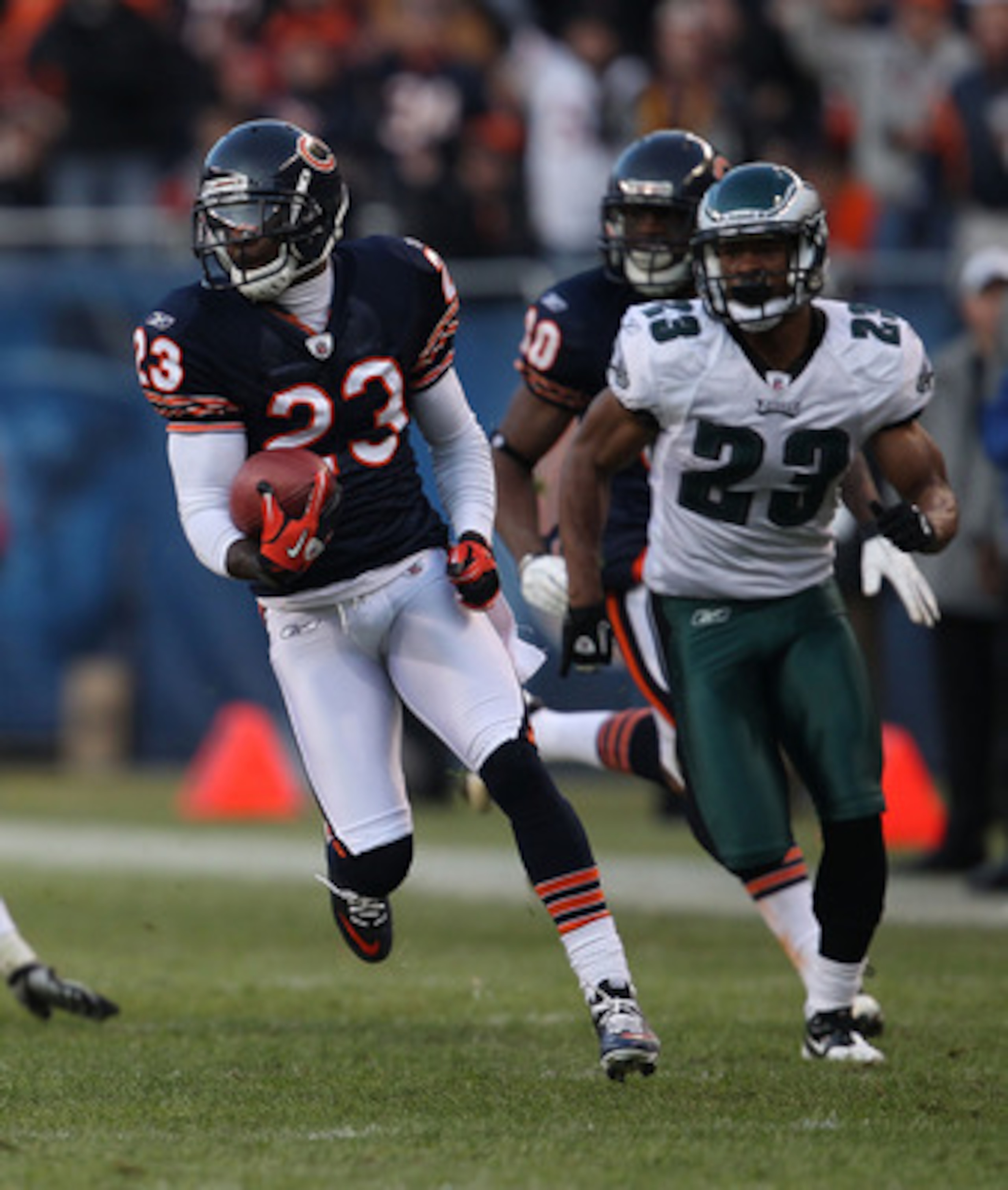 CHICAGO - NOVEMBER 28: Devin Hester #23 of the Chicago Bears breaks for a first down run of 39 yards after a catch pursued by Dimitri Patterson #23 of the Philadelphia Eagles at Soldier Field on November 28, 2010 in Chicago, Illinois. The Bears defeated t CHICAGO - NOVEMBER 28: Devin Hester #23 of the Chicago Bears breaks for a first down run of 39 yards after a catch pursued by Dimitri Patterson #23 of the Philadelphia Eagles at Soldier Field on November 28, 2010 in Chicago, Illinois. The Bears defeated t