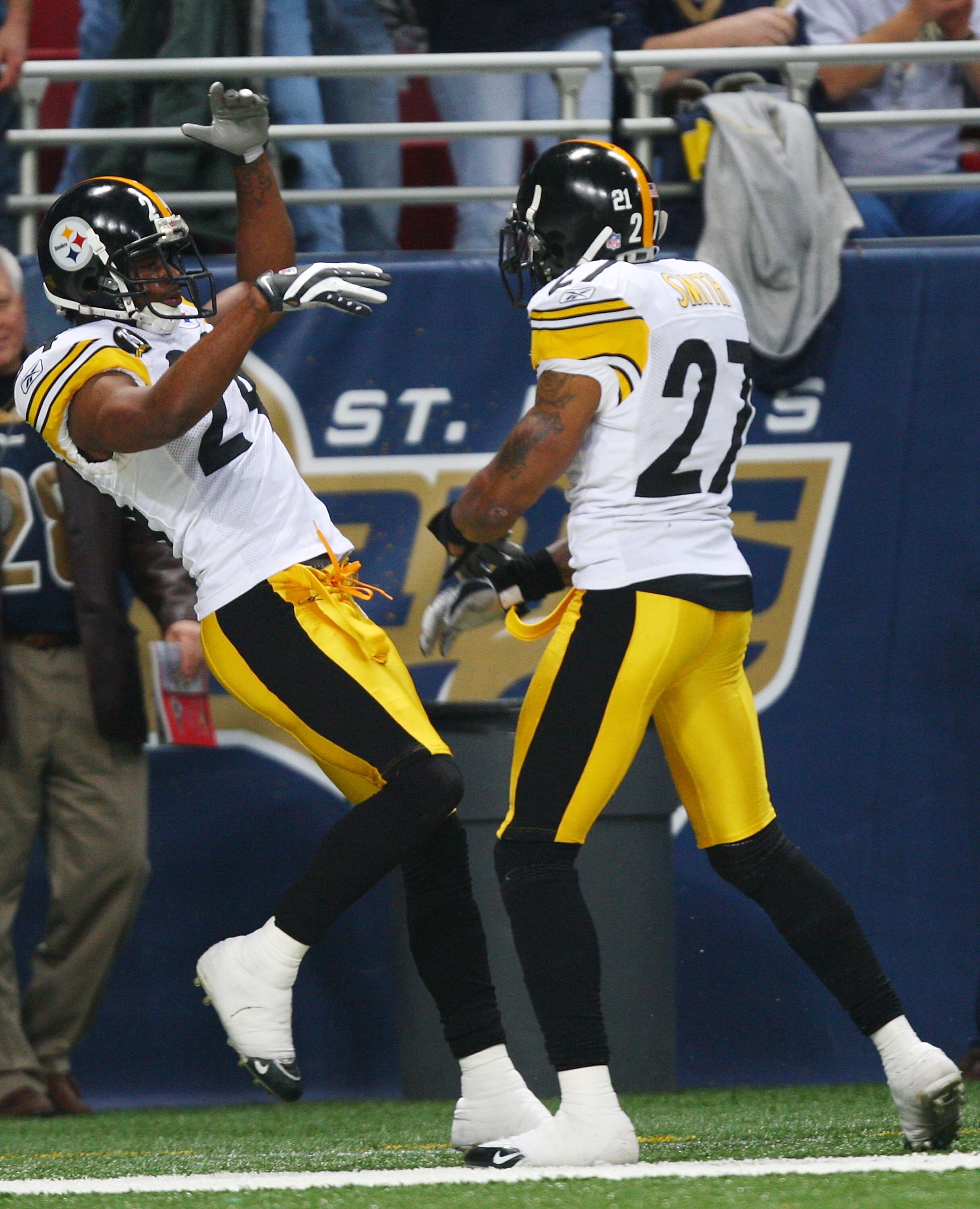 ST. LOUIS - DECEMBER 20:   Ike Taylor #24 of the Pittsburgh Steelers is congratulated by teammate Anthony Smith #27 after Taylor intercepted a pass and ran it in for a touchdown againt St. Louis Rams in the fourth quarter on December 20, 2007 at Edward Jo