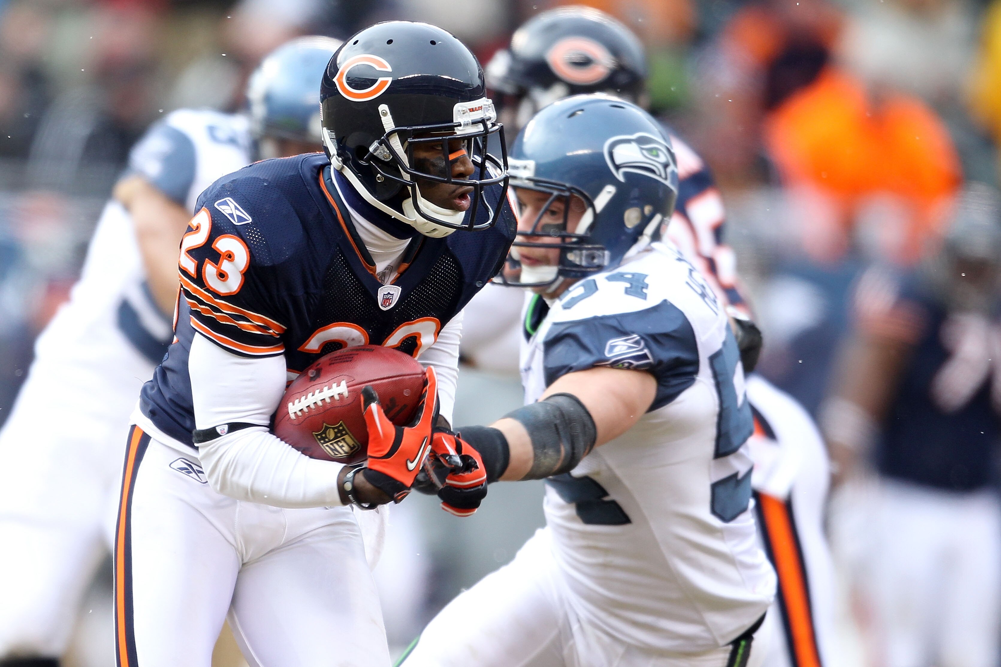 CHICAGO, IL - JANUARY 16:  Devin Hester #23 of the Chicago Bears returns a kick against the Seattle Seahawks in the 2011 NFC divisional playoff game at Soldier Field on January 16, 2011 in Chicago, Illinois.  (Photo by Andy Lyons/Getty Images)