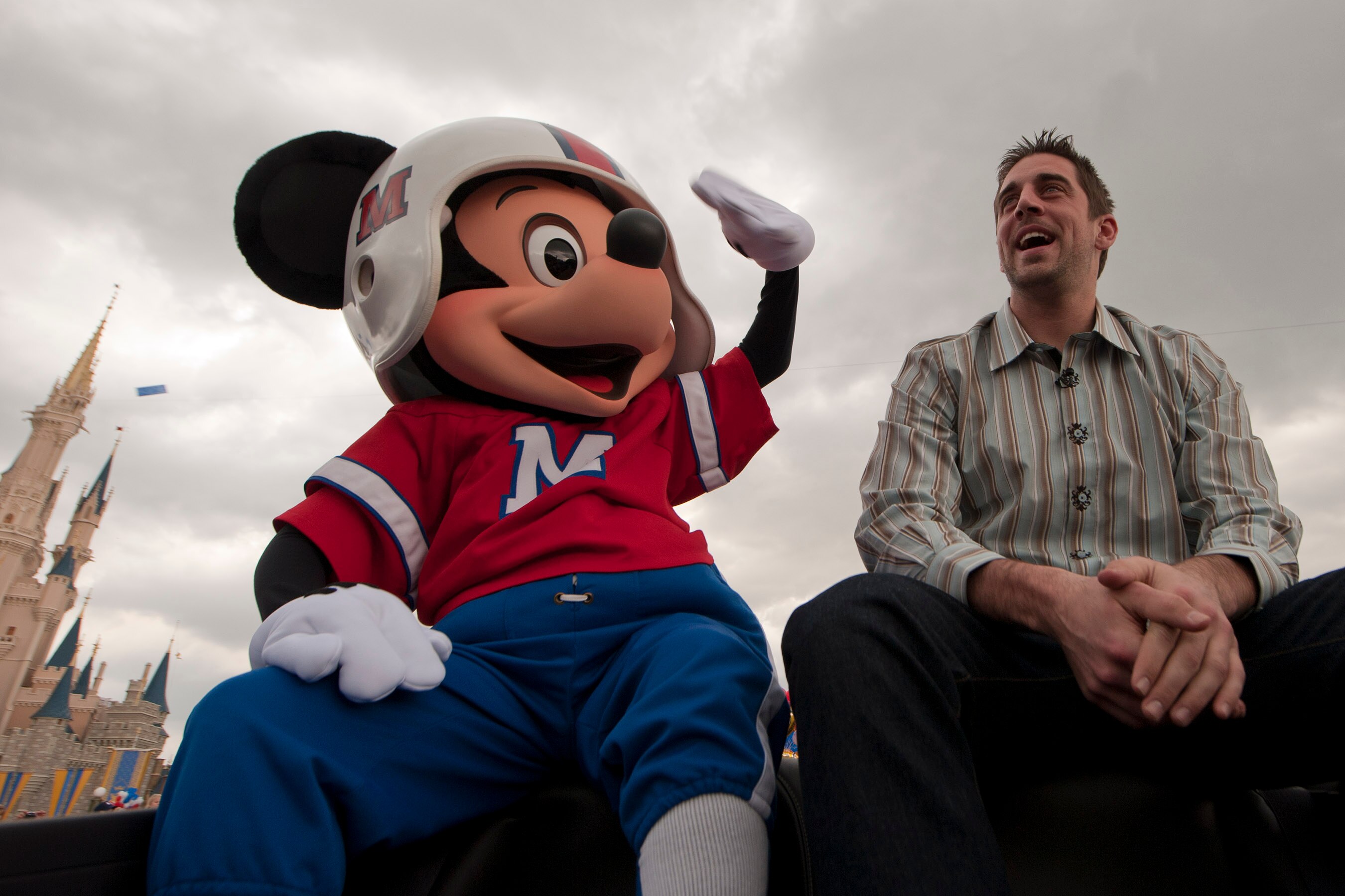 LAKE BUENA VISTA, FL - FEBRUARY 07:  In this handout photo provided by Disney, Super Bowl XLV Most Valuable Player Aaron Rodgers takes a celebratory ride with Mickey Mouse, following the Green Bay Packers' 31-25 victory over the Pittsburgh Steelers Februa