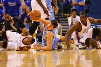 OKLAHOMA CITY, OK - APRIL 17: Russell Westbrook #0 and Serge Ibaka #9 both of the Oklahoma City Thunder look to beat Danilo Gallinari #8 of the Denver Nuggets to a loose ball in Game One of the Western Conference Quarterfinals in the 2011 NBA Playoffs on