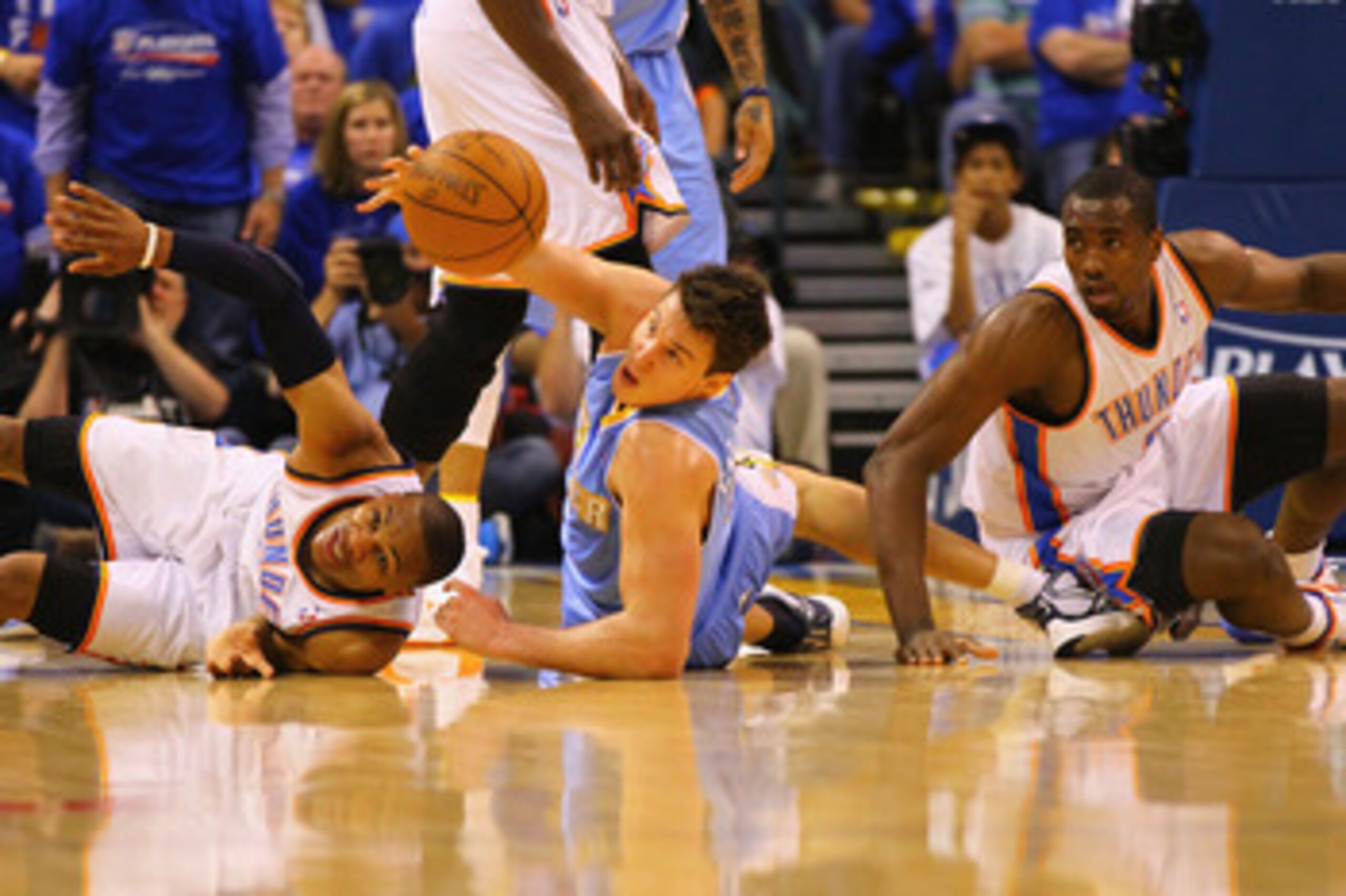 OKLAHOMA CITY, OK - APRIL 17: Russell Westbrook #0 and Serge Ibaka #9 both of the Oklahoma City Thunder look to beat Danilo Gallinari #8 of the Denver Nuggets to a loose ball in Game One of the Western Conference Quarterfinals in the 2011 NBA Playoffs on
