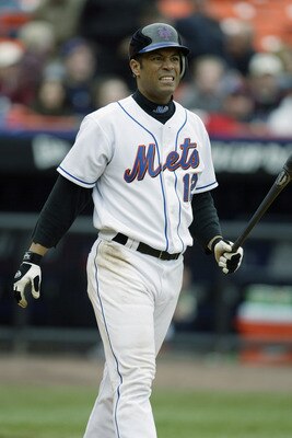FLUSHING, NY - APRIL 03:  Roberto Alomar #12 of the New York Mets grimaces after striking out with men on during the game against the Chicago Cubs at Shea Stadium on April 3, 2003 in Flushing, New York.  The Cubs defeated the Mets 10-9.  (Photo by Al Bell