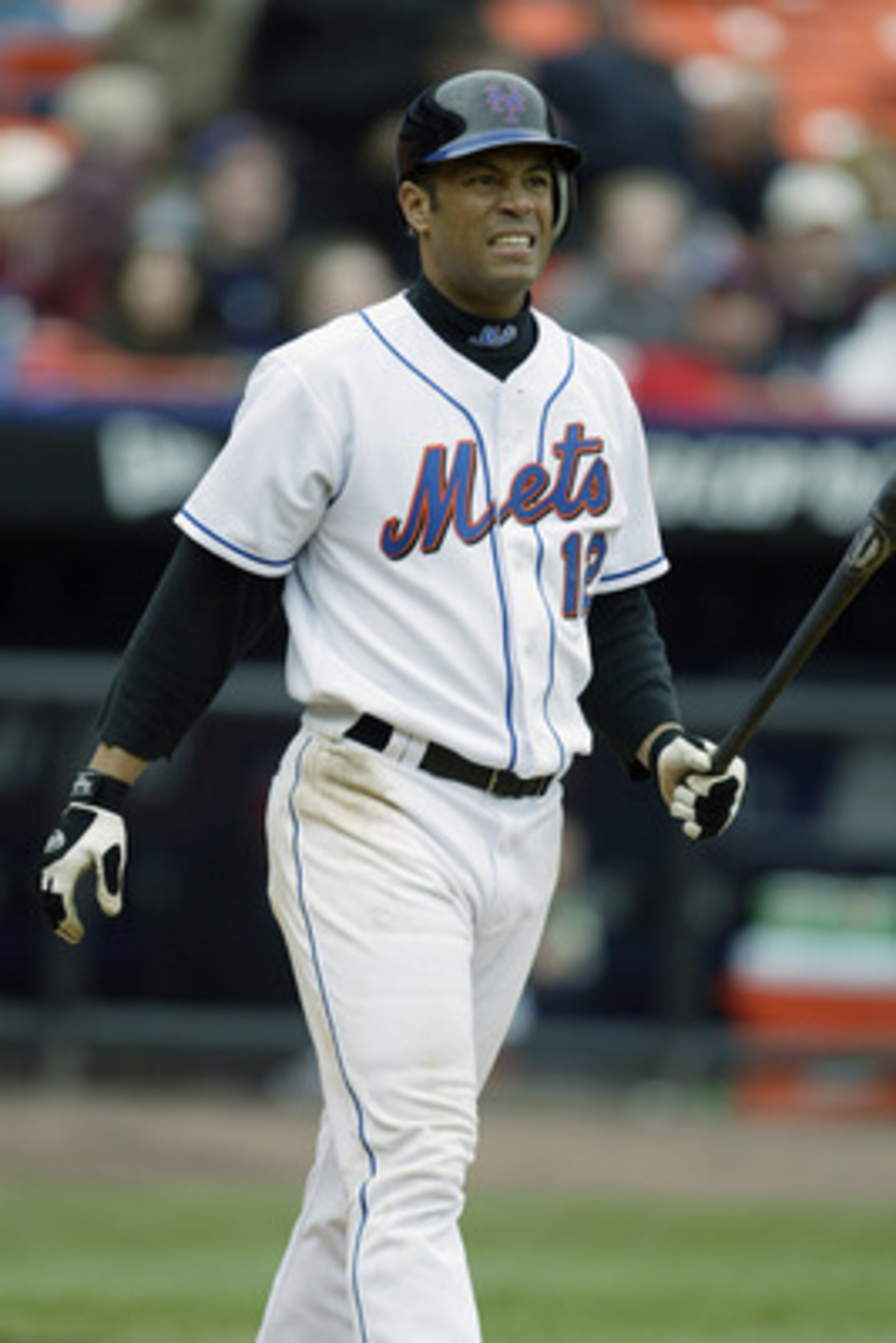 FLUSHING, NY - APRIL 03:  Roberto Alomar #12 of the New York Mets grimaces after striking out with men on during the game against the Chicago Cubs at Shea Stadium on April 3, 2003 in Flushing, New York.  The Cubs defeated the Mets 10-9.  (Photo by Al Bell