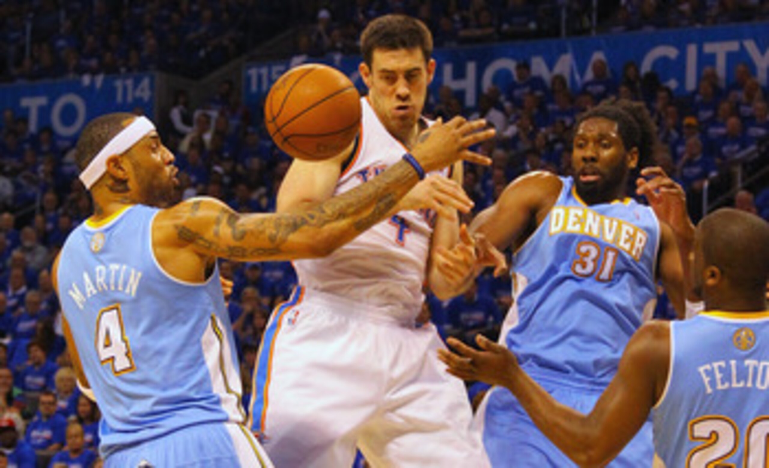 OKLAHOMA CITY, OK - APRIL 17: Nick Collison #4 of the Oklahoma City Thunder fights for a rebound against Kenyon Martin #4 and Nene #31 of the Denver Nuggets in Game One of the Western Conference Quarterfinals in the 2011 NBA Playoffs on April 17, 2011 at