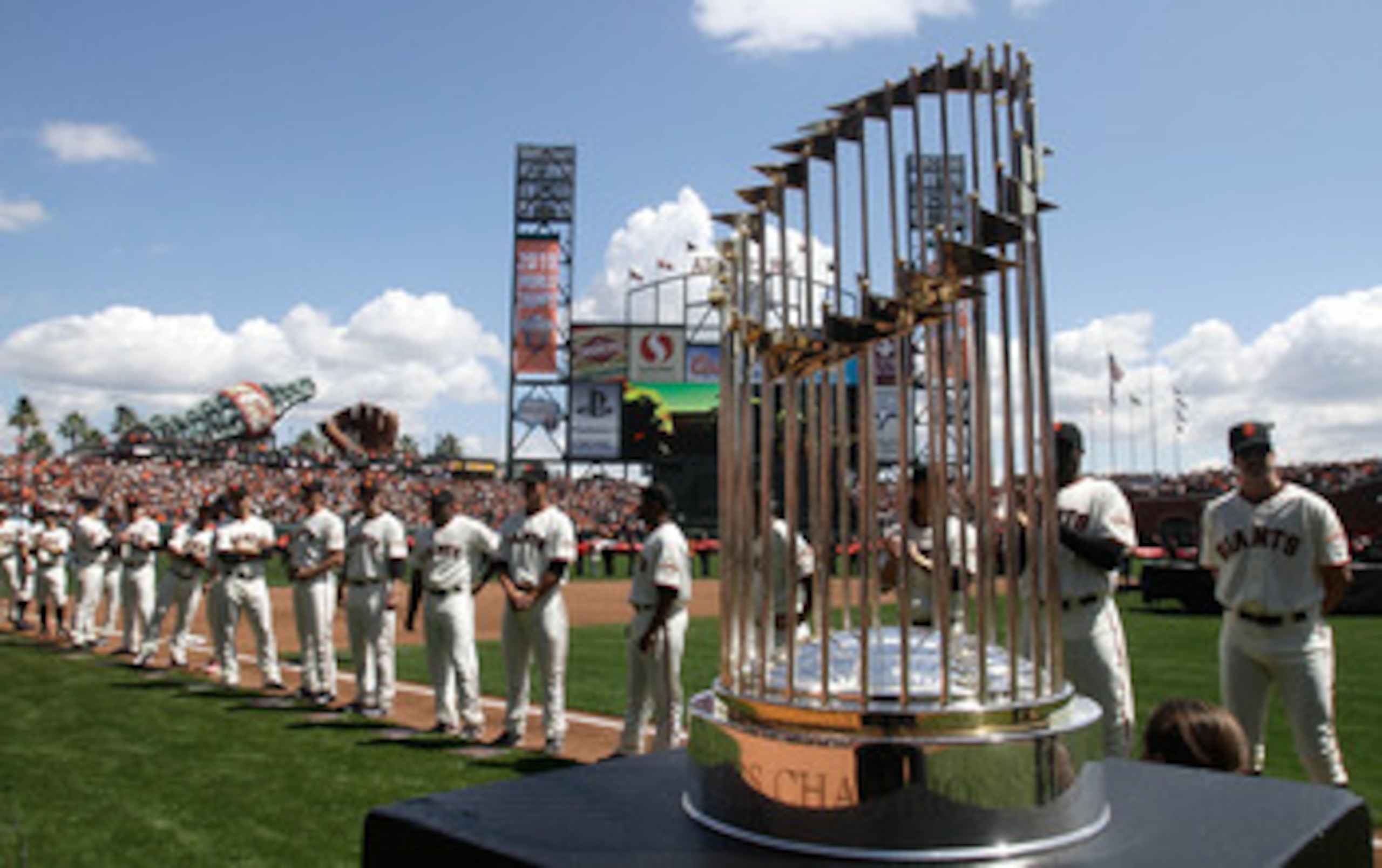 SAN FRANCISCO, CA - APRIL 08:  The 2010 World Series trophy is displayed as San Francisco Giants players line up before the start of the Giants' opening day game against the St. Louis Cardinals at AT&T Park on April 8, 2011 in San Francisco, California.