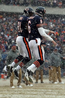 CHICAGO, IL - JANUARY 16:  Quarterback Jay Cutler #6 of the Chicago Bears celebrates his six-yard touchdown run with teammate Rashied Davis #81 against the Seattle Seahawks in the second quarter of the 2011 NFC divisional playoff game at Soldier Field on