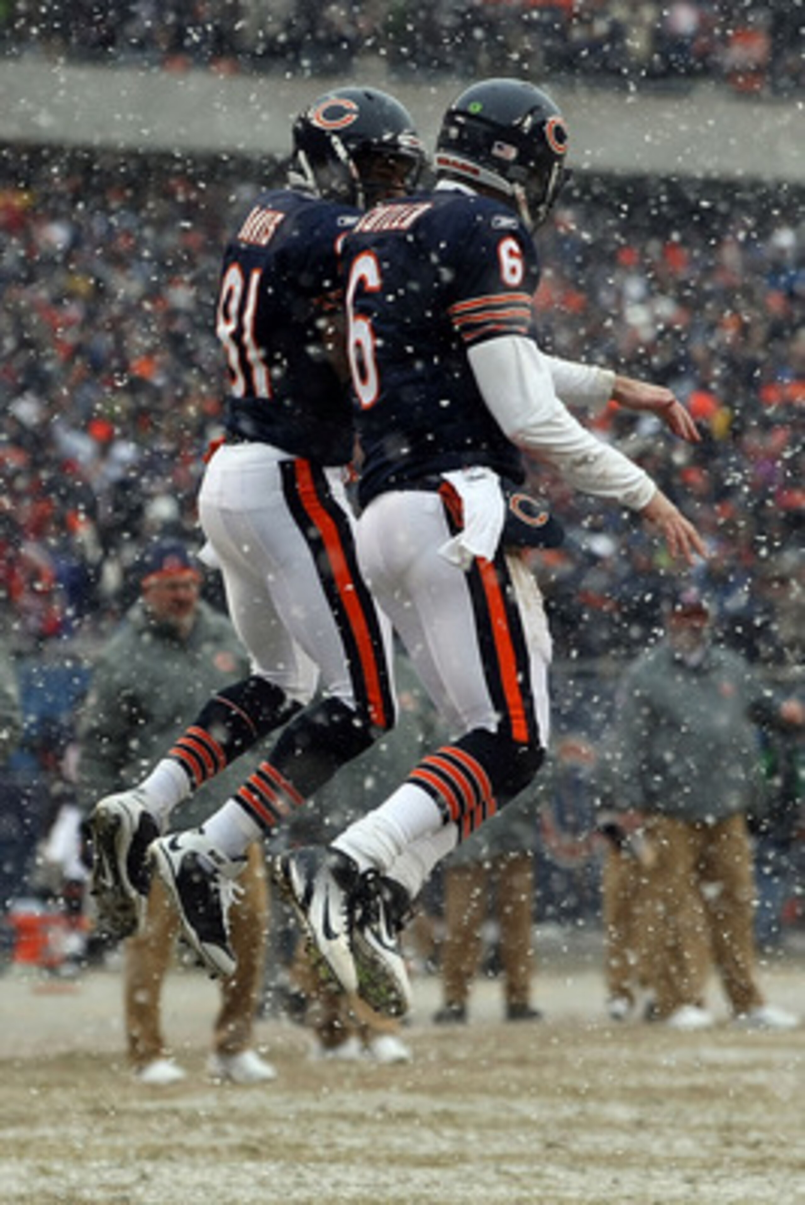 CHICAGO, IL - JANUARY 16: Quarterback Jay Cutler #6 of the Chicago Bears celebrates his six-yard touchdown run with teammate Rashied Davis #81 against the Seattle Seahawks in the second quarter of the 2011 NFC divisional playoff game at Soldier Field on CHICAGO, IL - JANUARY 16: Quarterback Jay Cutler #6 of the Chicago Bears celebrates his six-yard touchdown run with teammate Rashied Davis #81 against the Seattle Seahawks in the second quarter of the 2011 NFC divisional playoff game at Soldier Field on