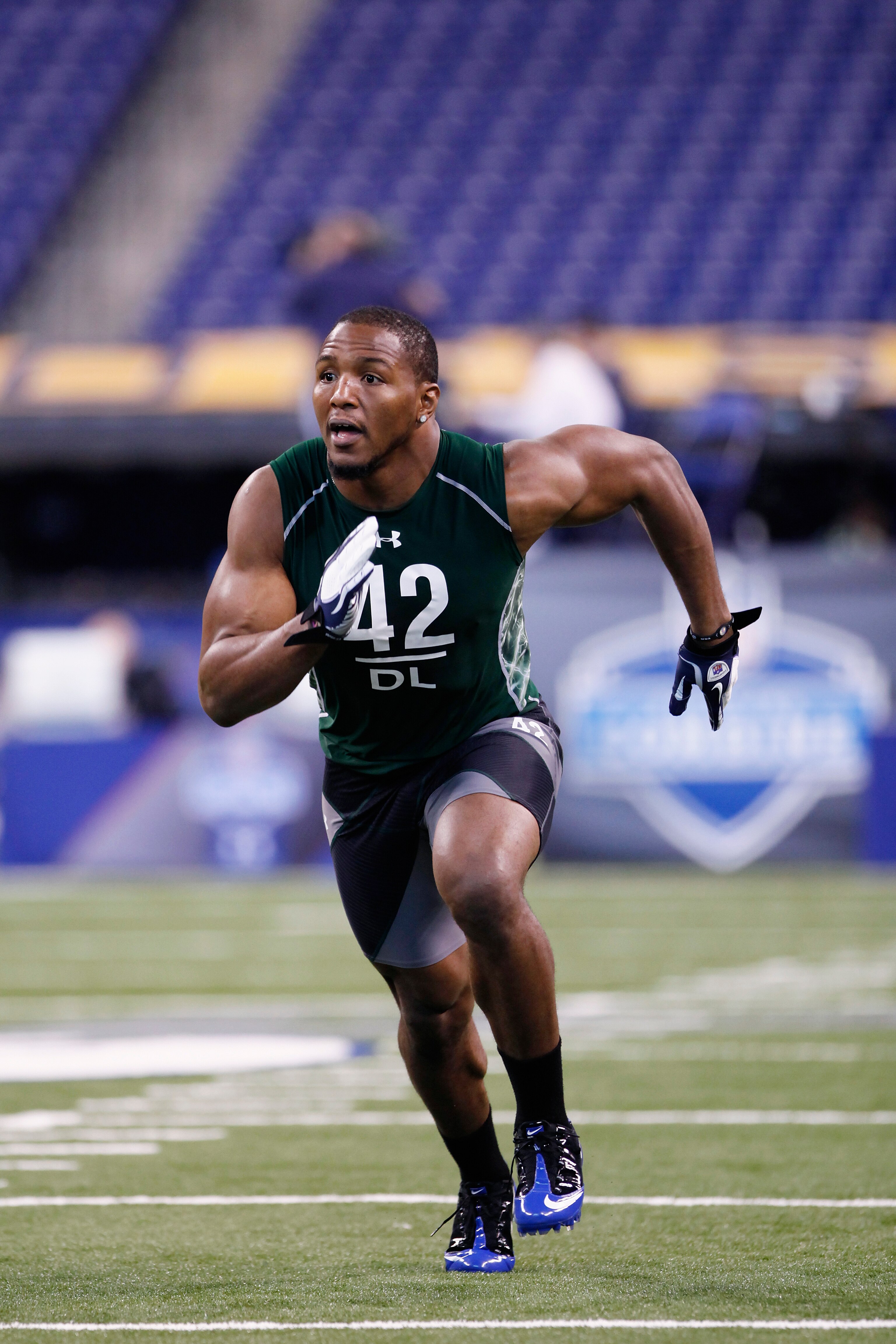 INDIANAPOLIS, IN - FEBRUARY 28: Defensive lineman Robert Quinn of North Carolina runs through a drill during the 2011 NFL Scouting Combine at Lucas Oil Stadium on February 28, 2011 in Indianapolis, Indiana. (Photo by Joe Robbins/Getty Images) INDIANAPOLIS, IN - FEBRUARY 28: Defensive lineman Robert Quinn of North Carolina runs through a drill during the 2011 NFL Scouting Combine at Lucas Oil Stadium on February 28, 2011 in Indianapolis, Indiana. (Photo by Joe Robbins/Getty Images)