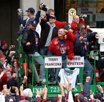 BOSTON - OCTOBER 30:  Fans cheer Boston Red Sox Manager Terry Francona and GM Theo Epstein during the Rolling Rally victory parade October 30, 2004 in Boston, Massachusetts. The Red Sox beat the St. Louis Cardinals in four straight games to take the teams