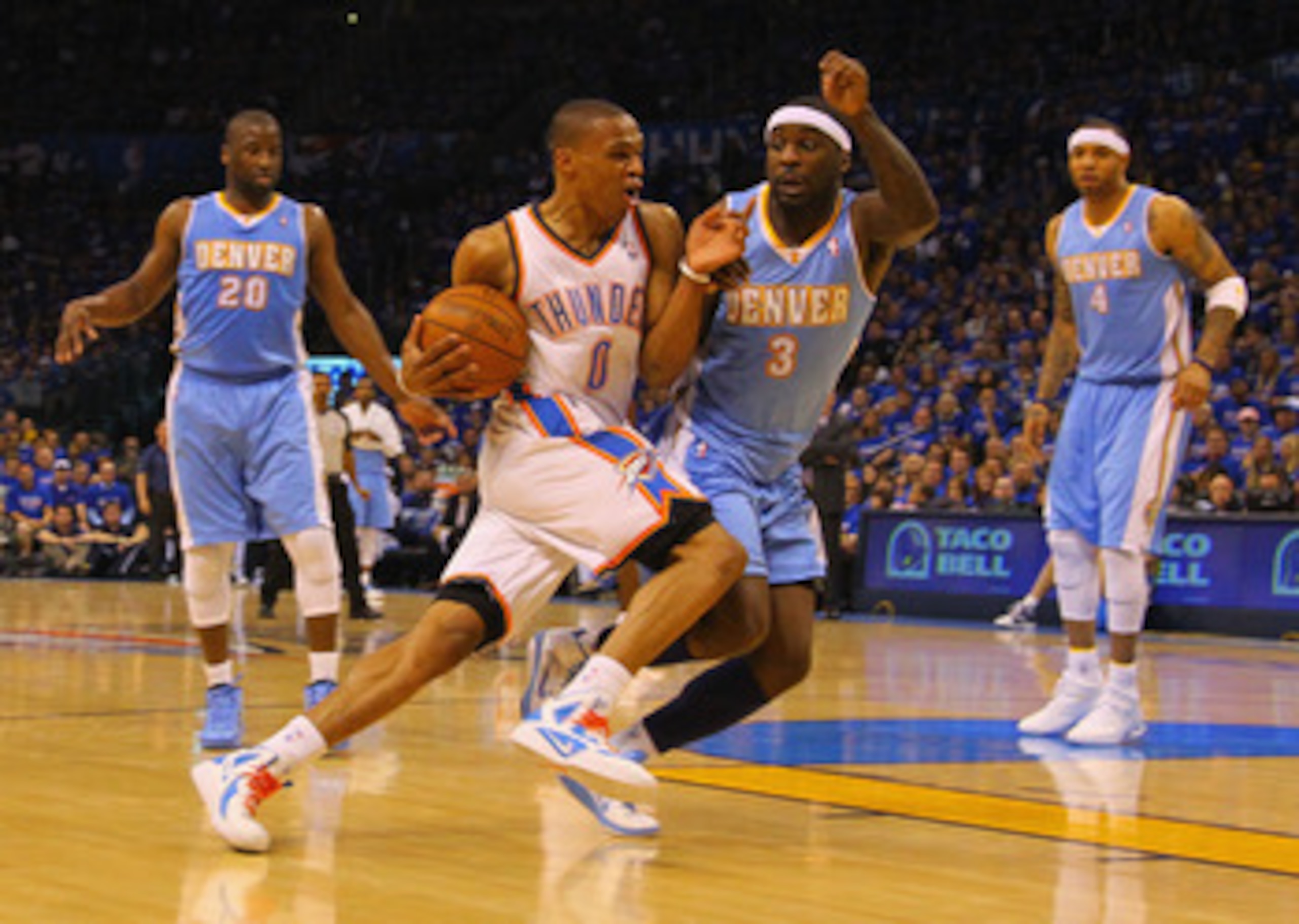 OKLAHOMA CITY, OK - APRIL 17: Russell Westbrook #0 of the Oklahoma City Thunder drives to the basket against Ty Lawson #3 of the Denver Nuggets in Game One of the Western Conference Quarterfinals in the 2011 NBA Playoffs on April 17, 2011 at the Ford Cent