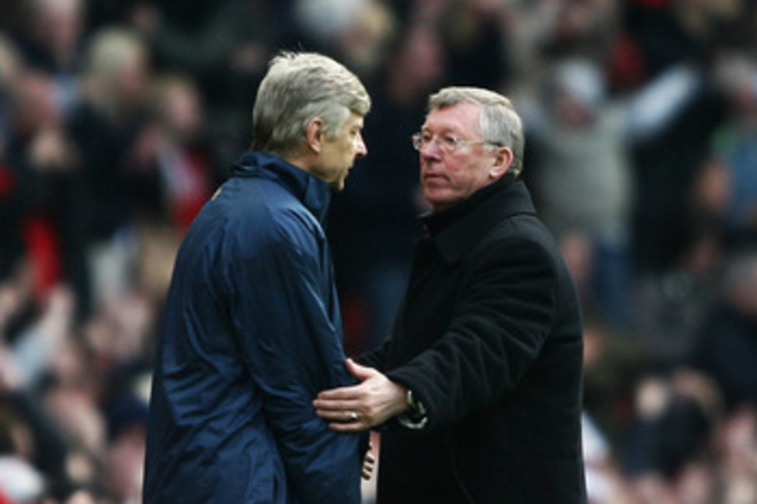 MANCHESTER, UNITED KINGDOM - APRIL 13:  Sir Alex Ferguson, manager of Manchester United consoles Arsene Wenger, manager of Arsenal after the Barclays Premier League match between Manchester United and Arsenal at Old Trafford on April 13, 2008 in Mancheste
