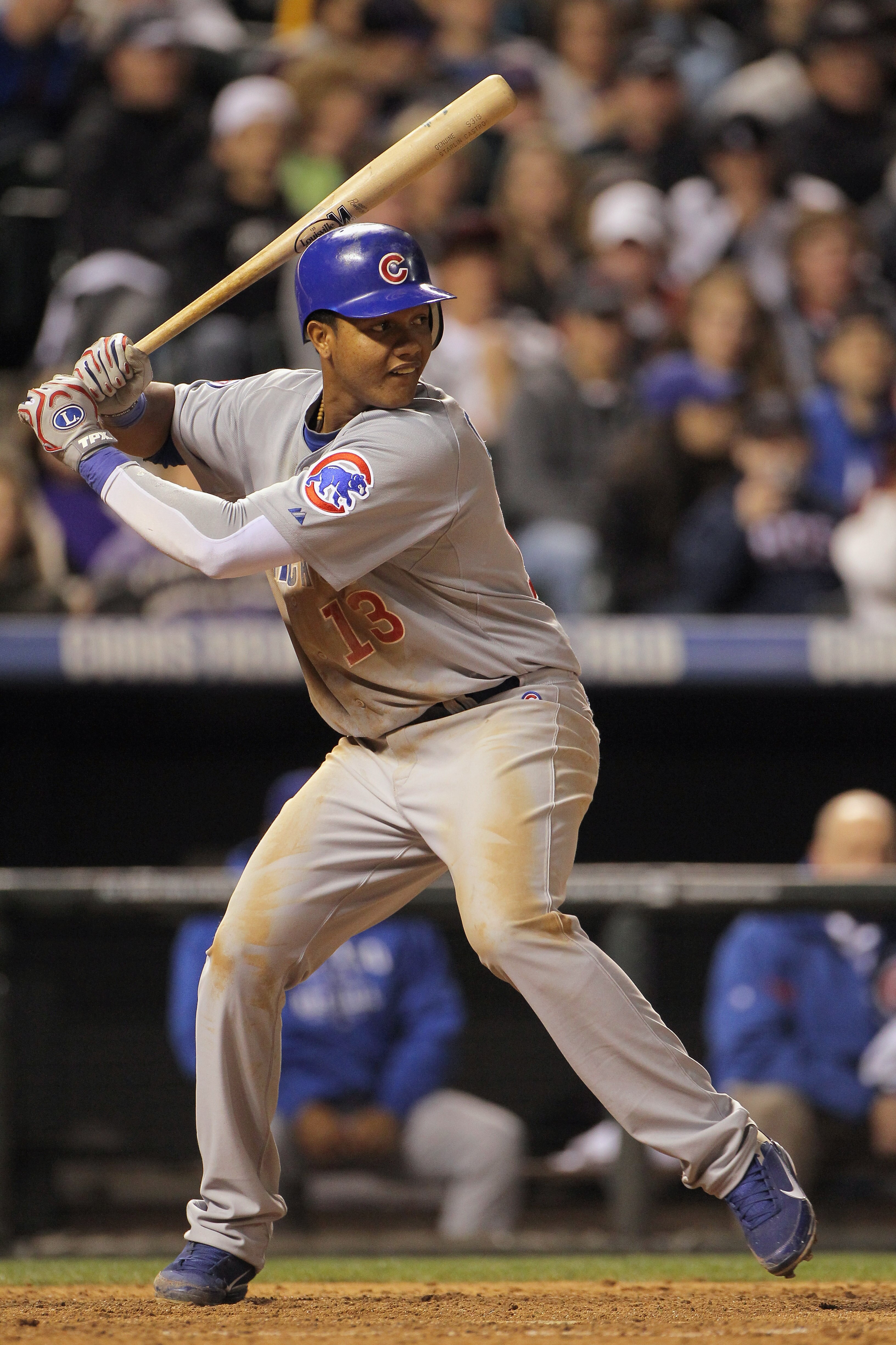 DENVER, CO - APRIL 16:  Starlin Castro #13 of the Chicago Cubs takes an at bat against the Colorado Rockies at Coors Field on April 16, 2011 in Denver, Colorado.  (Photo by Doug Pensinger/Getty Images)