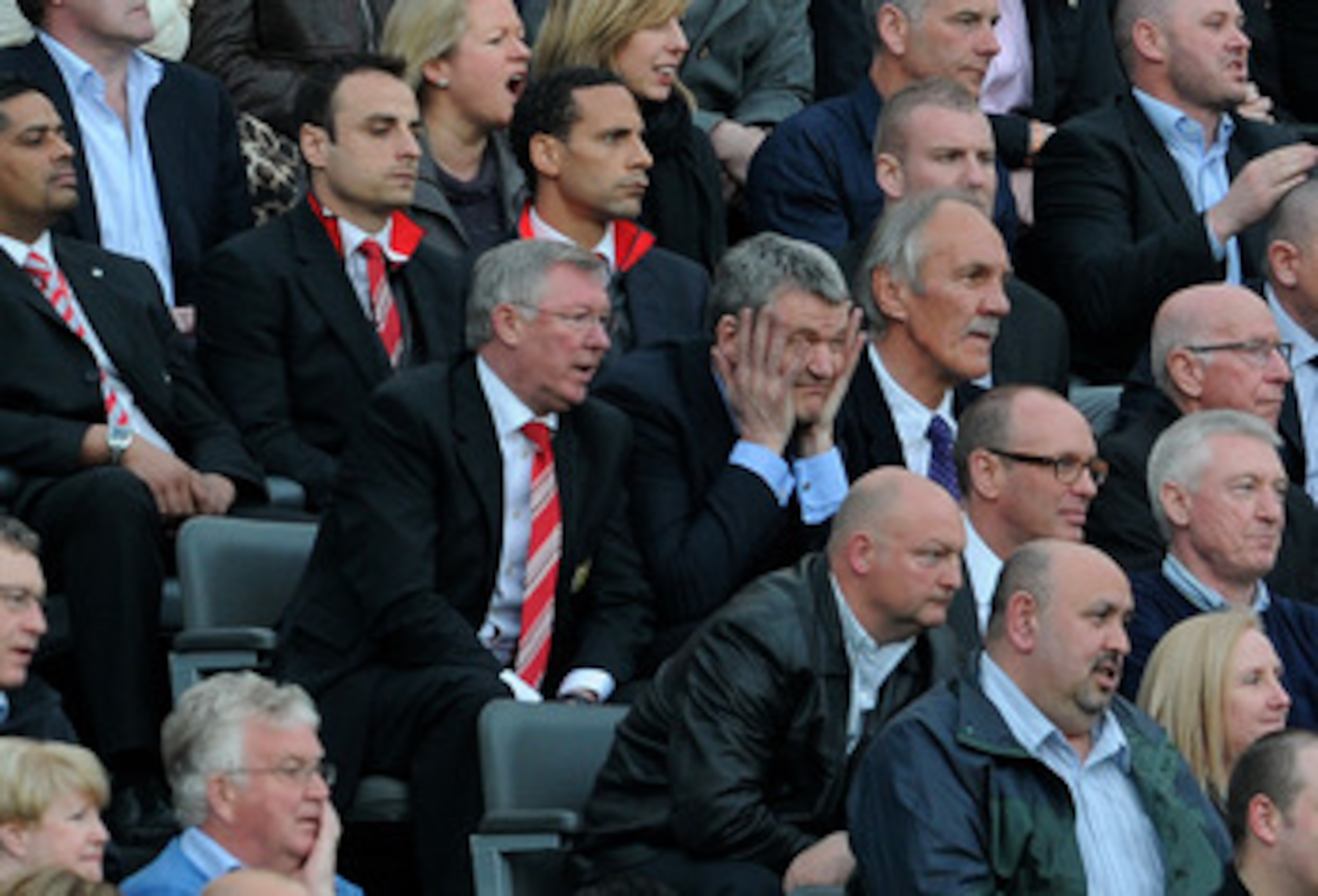 NEWCASTLE UPON TYNE, ENGLAND - APRIL 19:  Manchester United Manager Sir Alex Ferguson looks on from the stands with Chief Executive David Gill during the Barclays Premier League match between Newcastle United and Manchester United at St James' Park on Apr