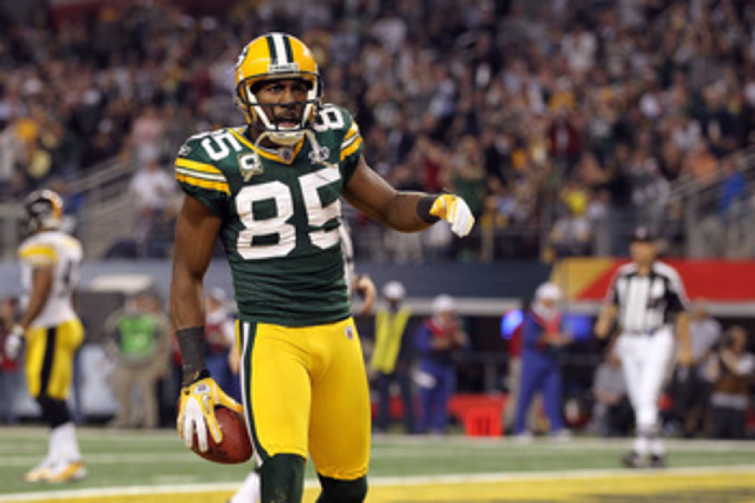 ARLINGTON, TX - FEBRUARY 06:  Greg Jennings #85 of the Green Bay Packers celebrates after catching a 21 yard pass for a touchdown against the Pittsburgh Steelers during Super Bowl XLV at Cowboys Stadium on February 6, 2011 in Arlington, Texas. The Packers