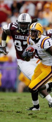 BATON ROUGE, LA - SEPTEMBER 22:  Brandon LaFell #1 of the Louisiana State University Tigers runs past Kenrick Ellis #97 and Mike Newton #42 of the South Carolina Gamecocks at Tiger Stadium September 22, 2007 in Baton Rouge, Louisiana.    (Photo by Chris G