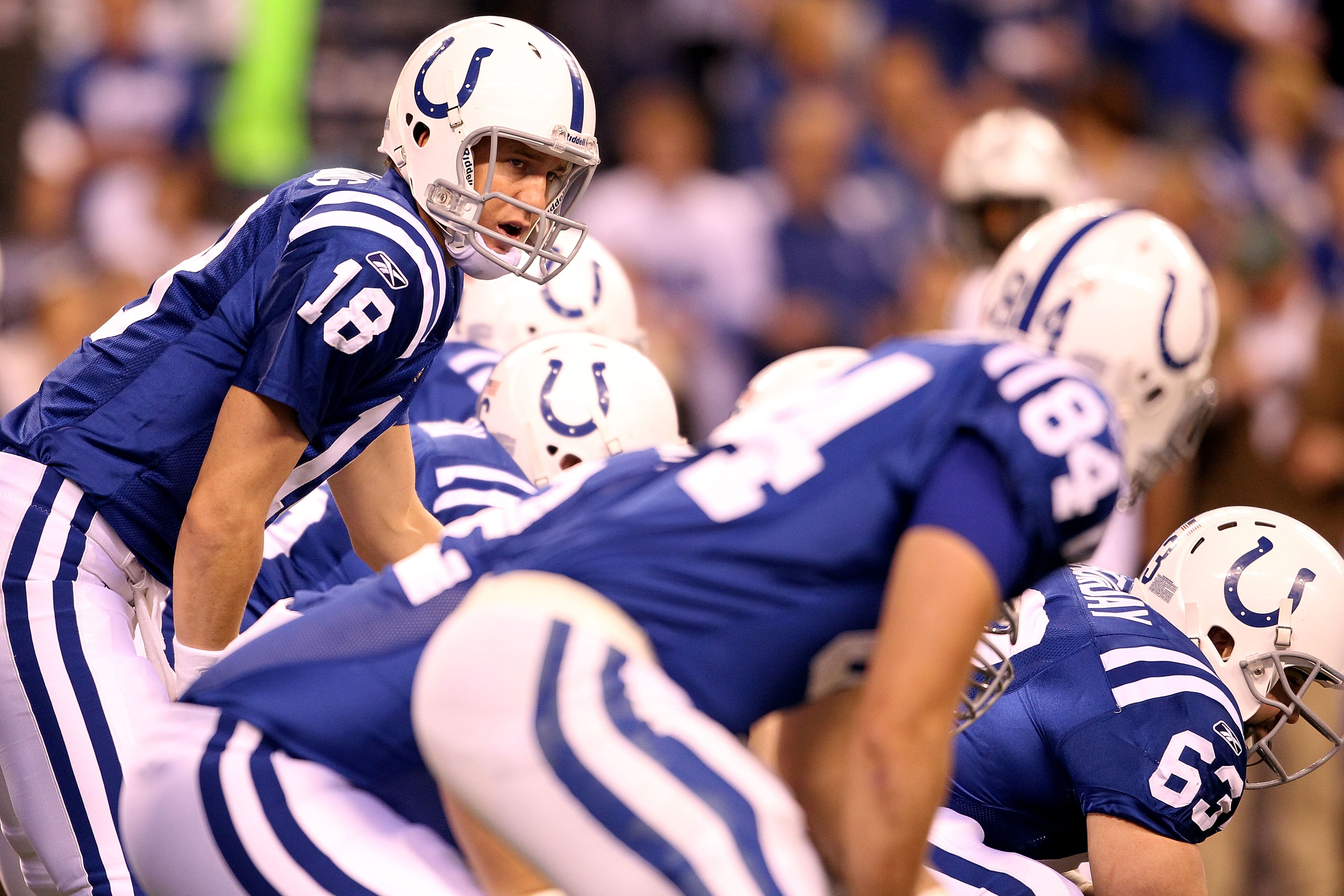 INDIANAPOLIS, IN - JANUARY 08:  Payton Manning #18 of the Indianapolis Colts calls out signals as he steps up to the line of scrimmage in the first quarter against the New York Jets during their 2011 AFC wild card playoff game at Lucas Oil Stadium on Janu