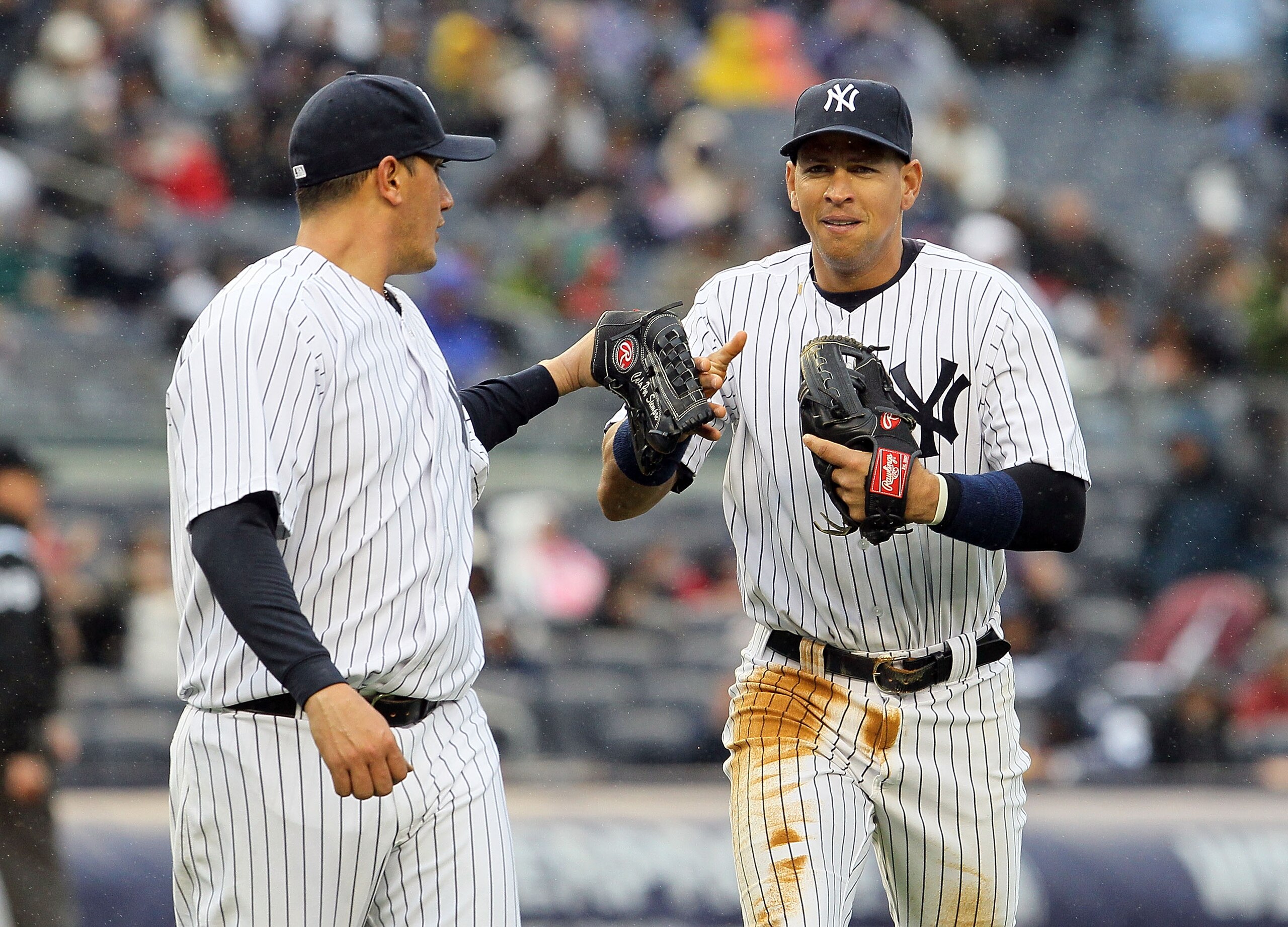 NEW YORK, NY - APRIL 16:  Freddy Garcia #36 and Alex Rodriguez #13 of the New York Yankees celebrate the final out of an inning against the Texas Rangers on April 16, 2011 at Yankee Stadium in the Bronx borough of New York City.  (Photo by Jim McIsaac/Get