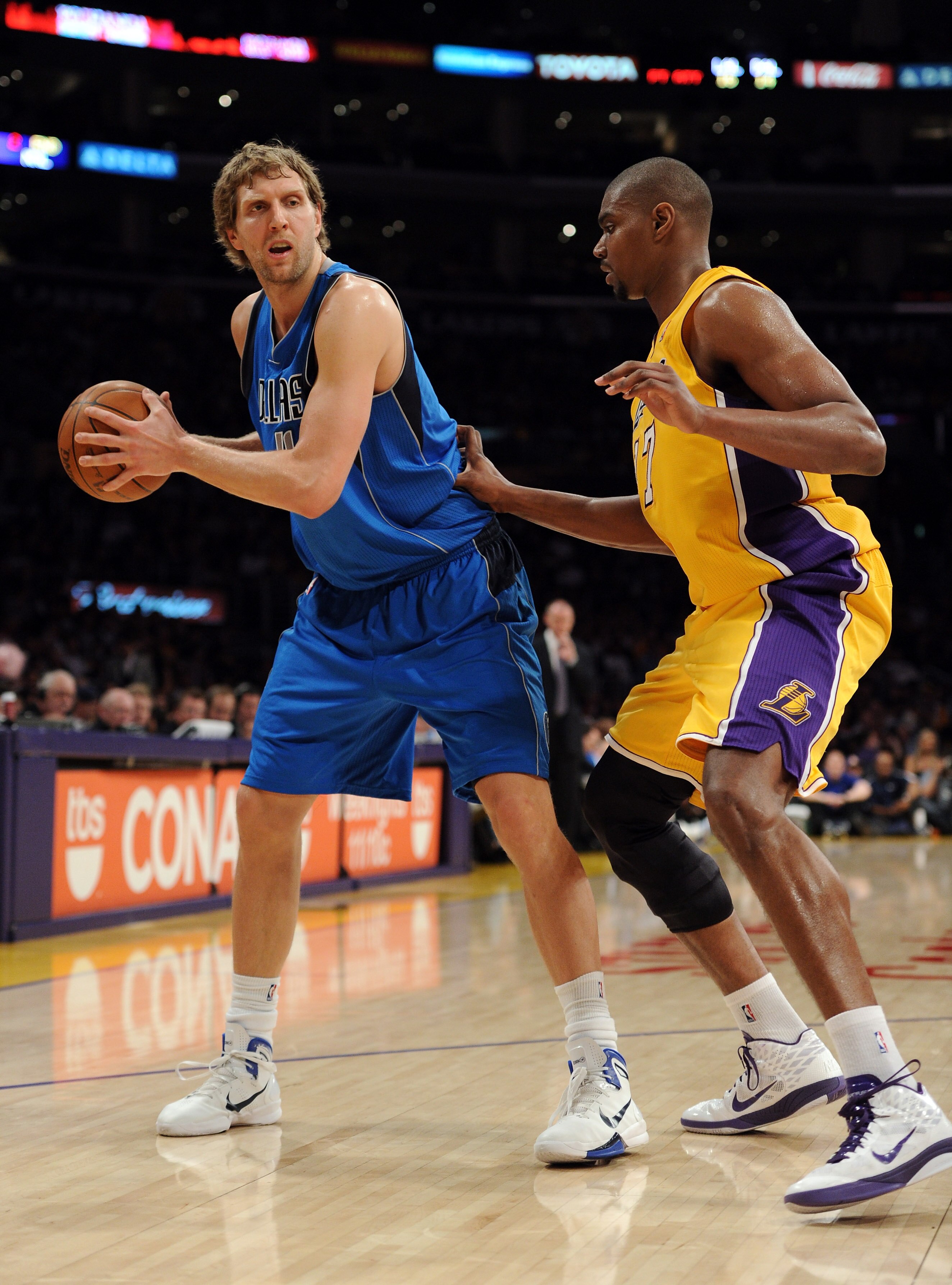LOS ANGELES, CA - MARCH 31:  Dirk Nowitzki #41 of the Dallas Mavericks is guarded by Andrew Bynum #17 of the Los Angeles Lakers at Staples Center on March 31, 2011 in Los Angeles, California.  NOTE TO USER: User expressly acknowledges and agrees that, by