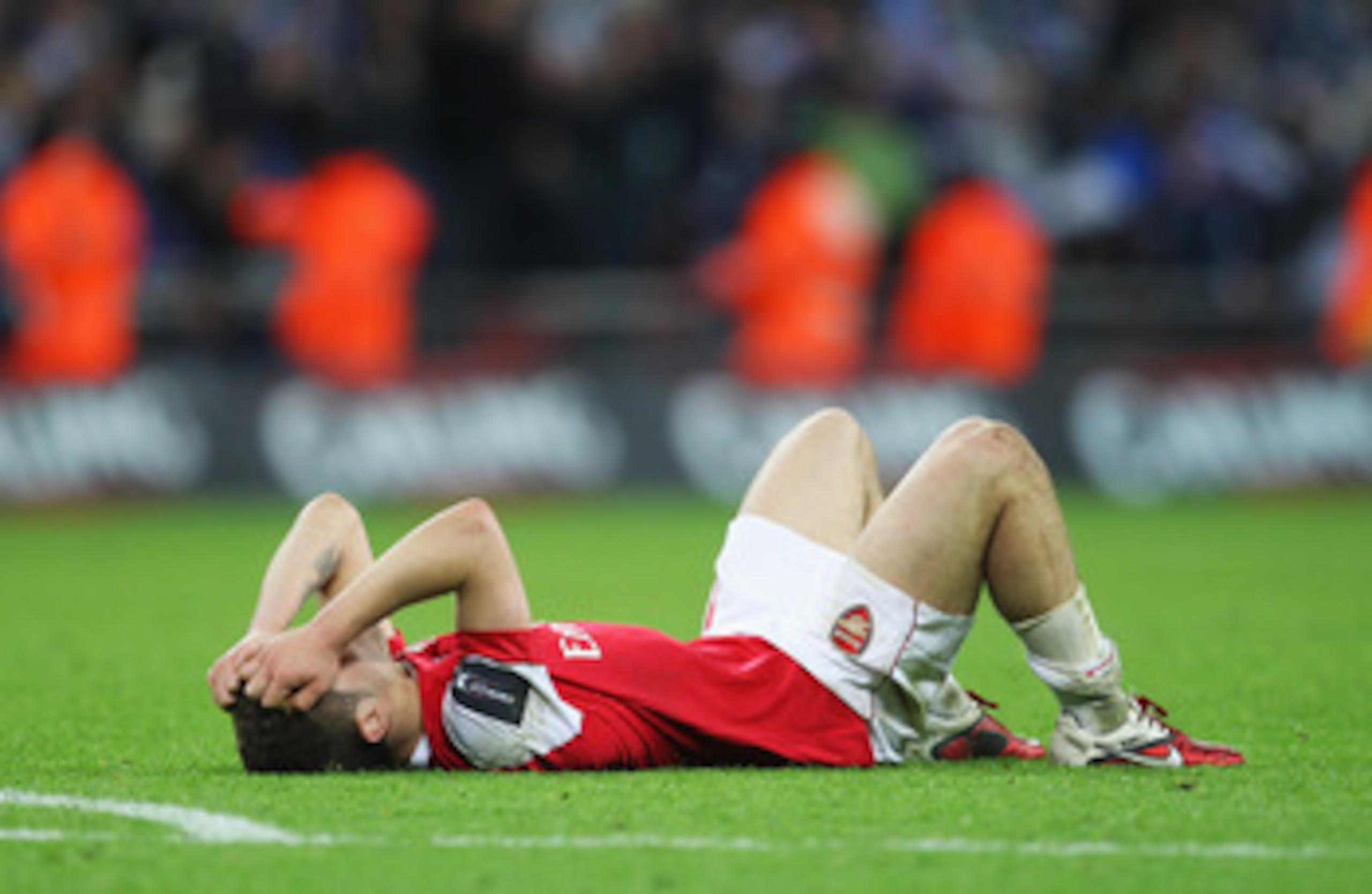 LONDON, ENGLAND - FEBRUARY 27:  Jack Wilshere of Arsenal holds his head in despair after the Carling Cup Final between Arsenal and Birmingham City at Wembley Stadium on February 27, 2011 in London, England.  (Photo by Alex Livesey/Getty Images)