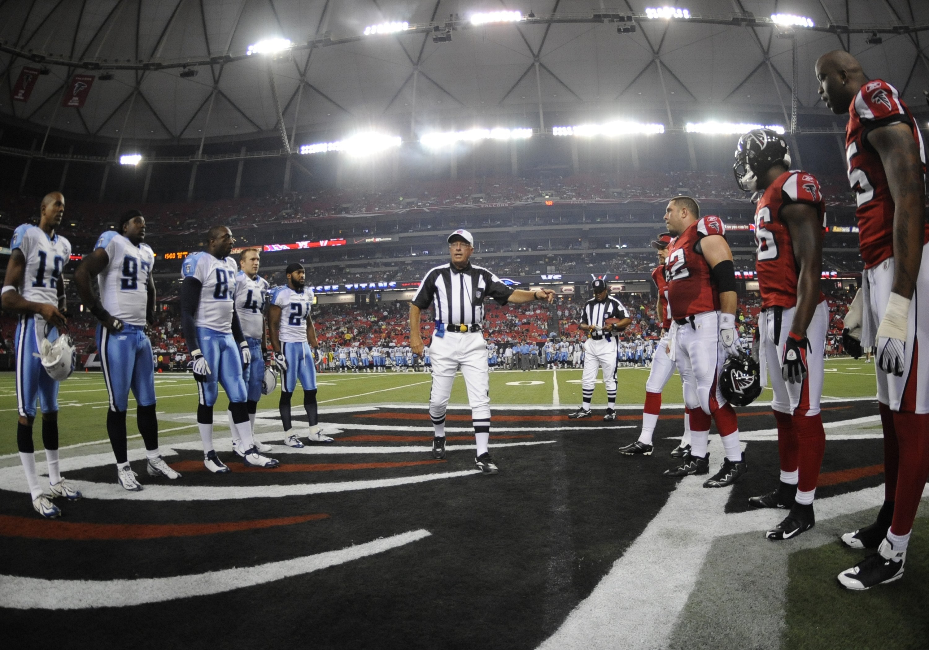 ATLANTA - AUGUST 22: Referee Ron Winter tosses the coin as the Atlanta Falcons host the Tennessee Titans at the Georgia Dome on August 22, 2008 in Atlanta, Georgia.  (Photo by Al Messerschmidt/Getty Images)