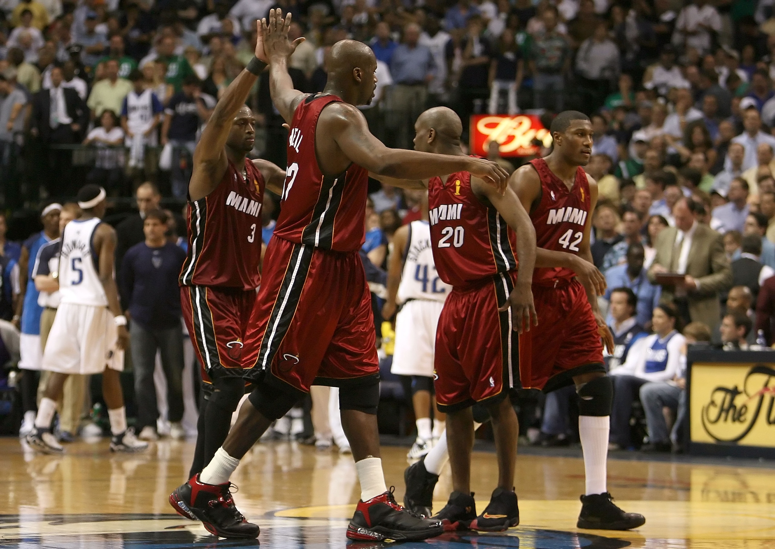 DALLAS - JUNE 20:  Dwyane Wade #3, Shaquille O'Neal #32, Gary Payton #20 and James Posey #42 of the Miami Heat celebrate together during a timeout against the Dallas Mavericks in game six of the 2006 NBA Finals on June 20, 2006 at American Airlines Center