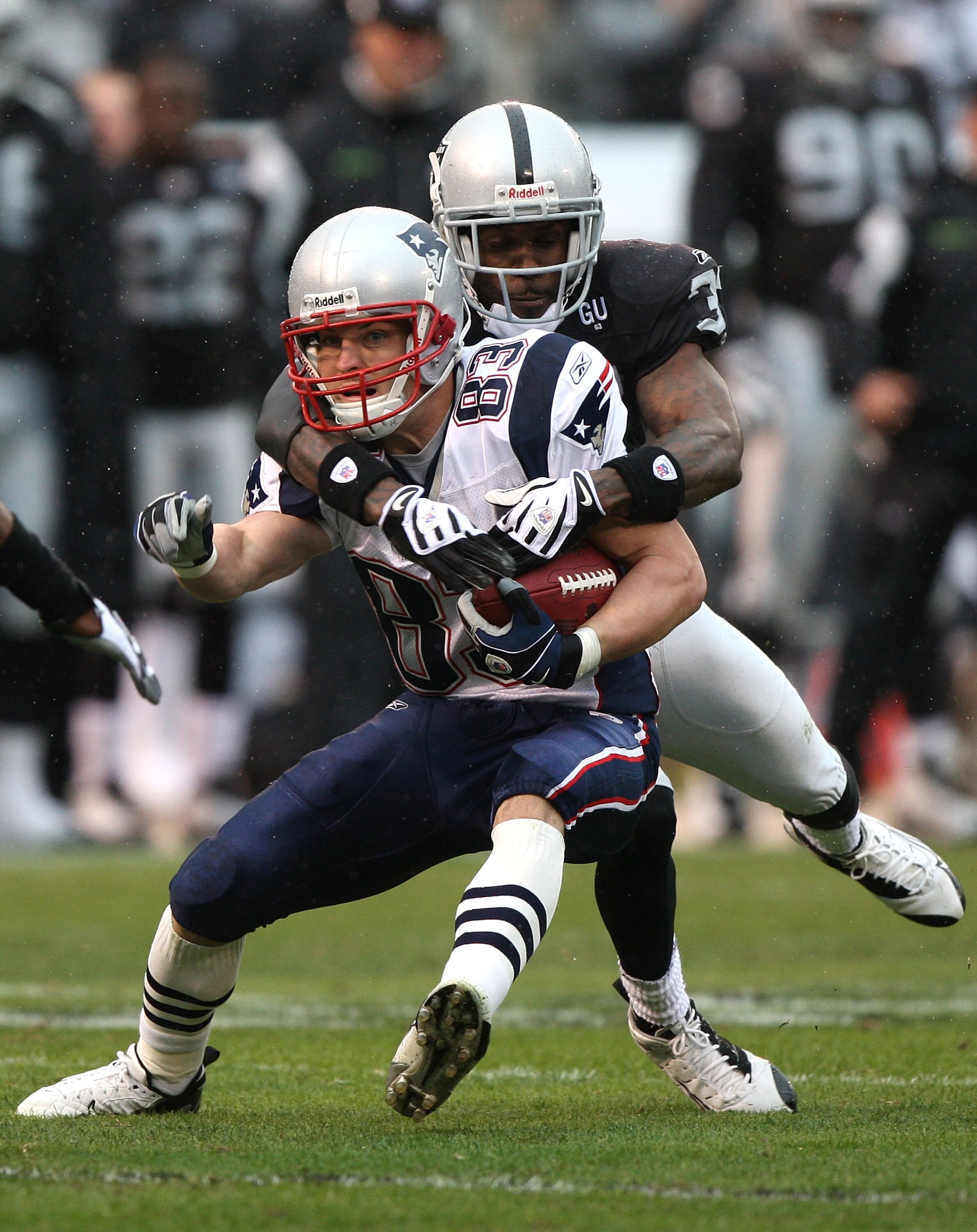 OAKLAND, CA - DECEMBER 14: Wes Welker #83 of the New England Patriots catches a pass as Chris Johnson #37 of the Oakland Raiders defends during an NFL game on December 14, 2008 at the Oakland-Alameda County Coliseum in Oakland, California.  (Photo by Jed 
