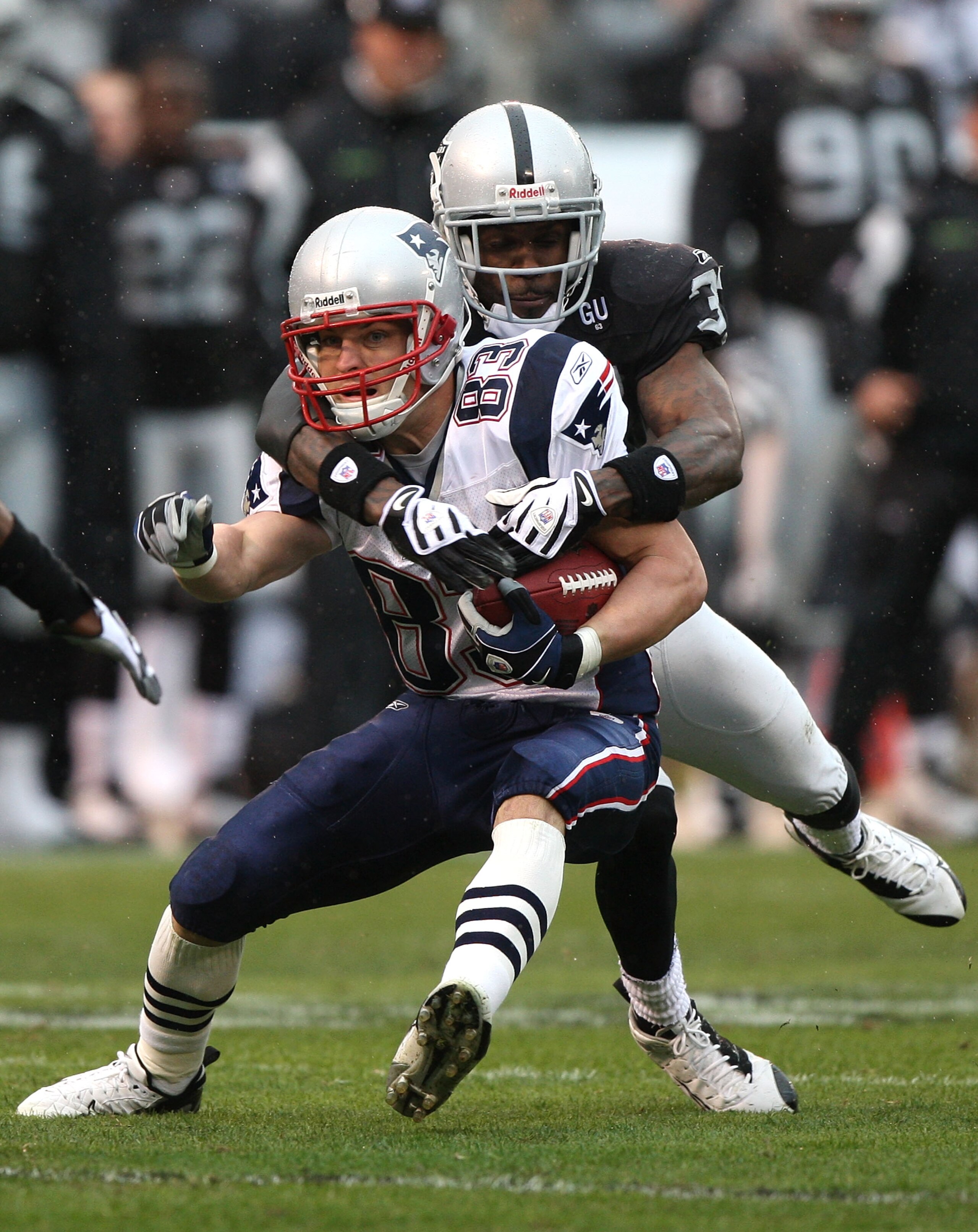 OAKLAND, CA - DECEMBER 14: Wes Welker #83 of the New England Patriots catches a pass as Chris Johnson #37 of the Oakland Raiders defends during an NFL game on December 14, 2008 at the Oakland-Alameda County Coliseum in Oakland, California.  (Photo by Jed 