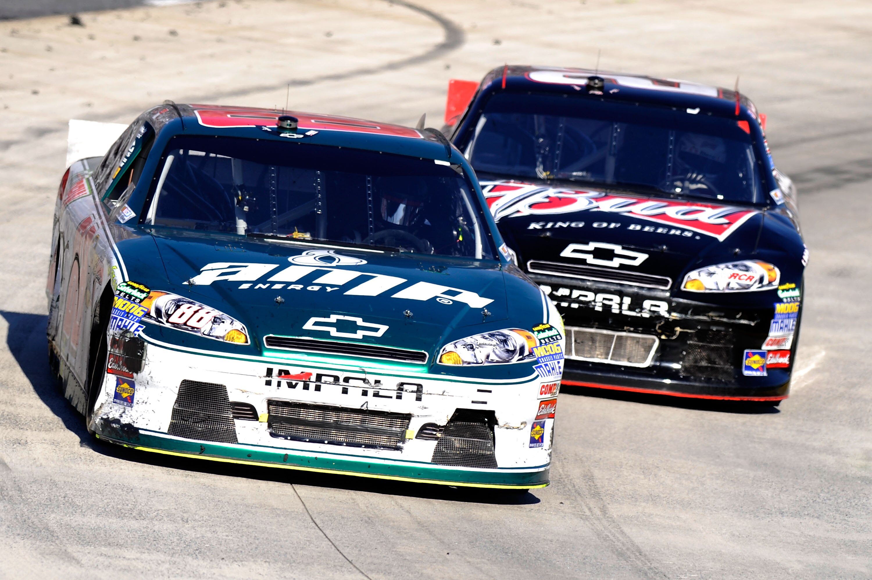 MARTINSVILLE, VA - APRIL 03:  Dale Earnhardt Jr., driver of the #88 Amp Energy/National Guard Chevrolet, leads Kevin Harvick, driver of the #29 Budweiser Chevrolet, during the NASCAR Sprint Cup Series Goody's Fast Relief 500 at Martinsville Speedway on Ap