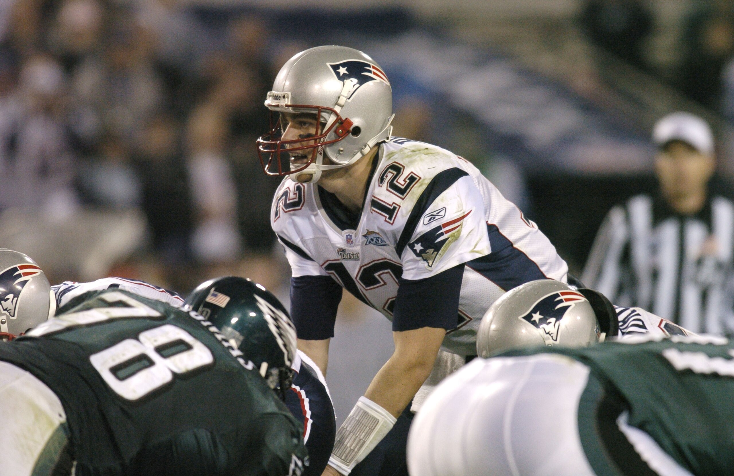 New England Patriots QB Tom Brady #12 makes a call during Super Bowl XXXIX between the Philadelphia Eagles and the New England Patriots at Alltel Stadium in Jacksonville, Florida on February 6, 2005.  (Photo by Al Messerschmidt/Getty Images)