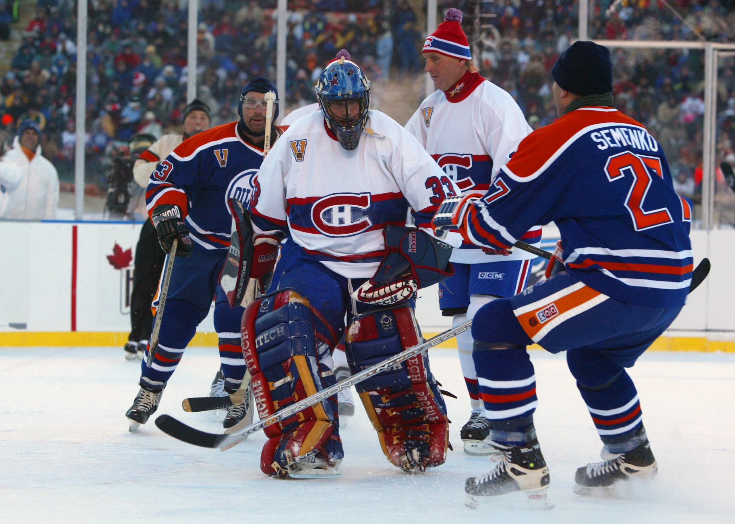EDMONTON, CANADA - NOVEMBER 22: Dave Semenko #33 of the Edmonton Oilers stops short of goaltender Richard Sevigny #33 of the Montreal Canadiens during the Molson Canadien Heritage Classic Megastars Game on November 22, 2003 at Commonwealth Stadium in Edm EDMONTON, CANADA - NOVEMBER 22: Dave Semenko #33 of the Edmonton Oilers stops short of goaltender Richard Sevigny #33 of the Montreal Canadiens during the Molson Canadien Heritage Classic Megastars Game on November 22, 2003 at Commonwealth Stadium in Edm