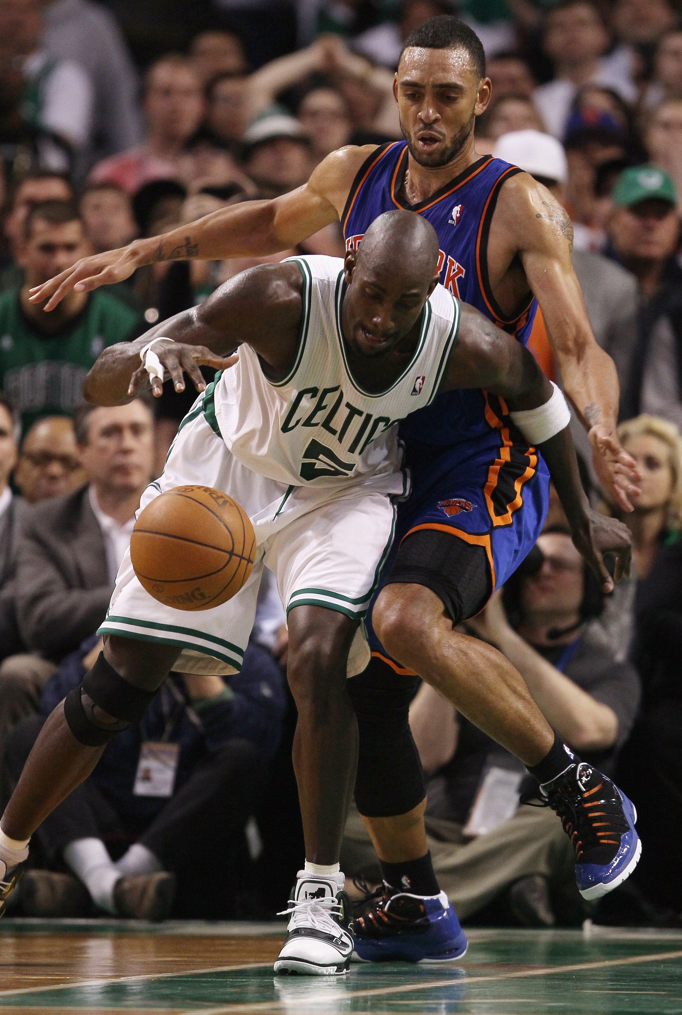 BOSTON, MA - APRIL 19:  Kevin Garnett #5 of the Boston Celtics heads for the basket around Jared Jeffries #9 of the New York Knicks  in Game Two of the Eastern Conference Quarterfinals in the 2011 NBA Playoffs on April 19, 2011 at the TD Garden in Boston,