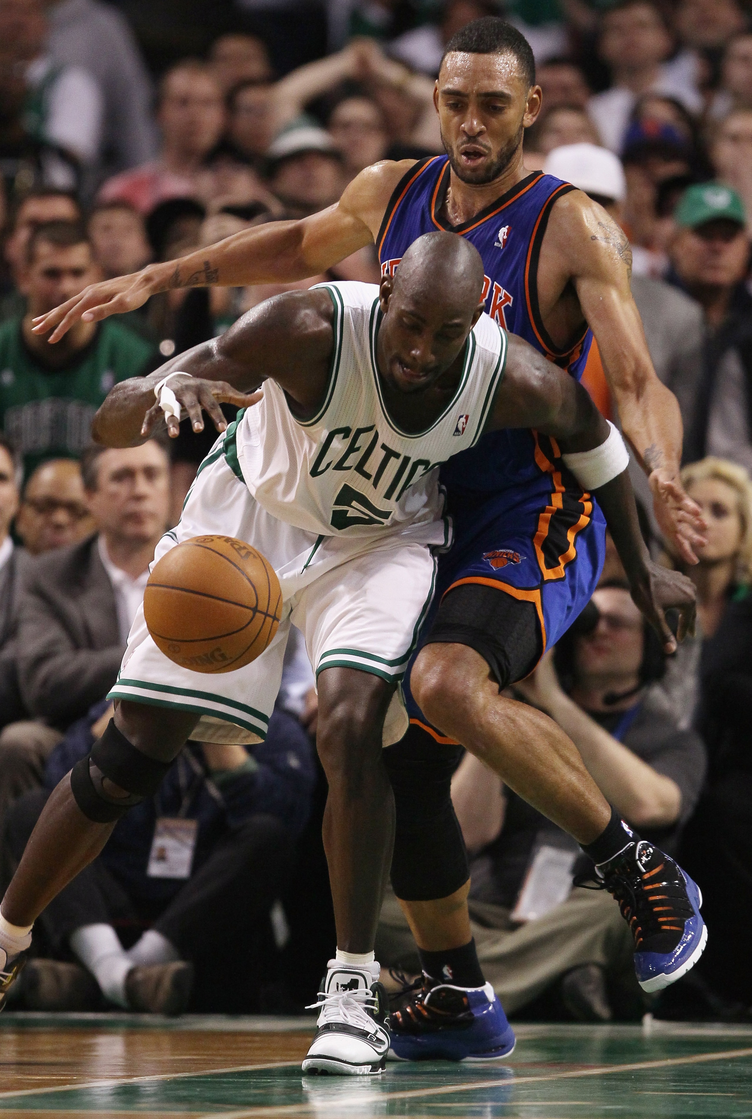 BOSTON, MA - APRIL 19:  Kevin Garnett #5 of the Boston Celtics heads for the basket around Jared Jeffries #9 of the New York Knicks  in Game Two of the Eastern Conference Quarterfinals in the 2011 NBA Playoffs on April 19, 2011 at the TD Garden in Boston,