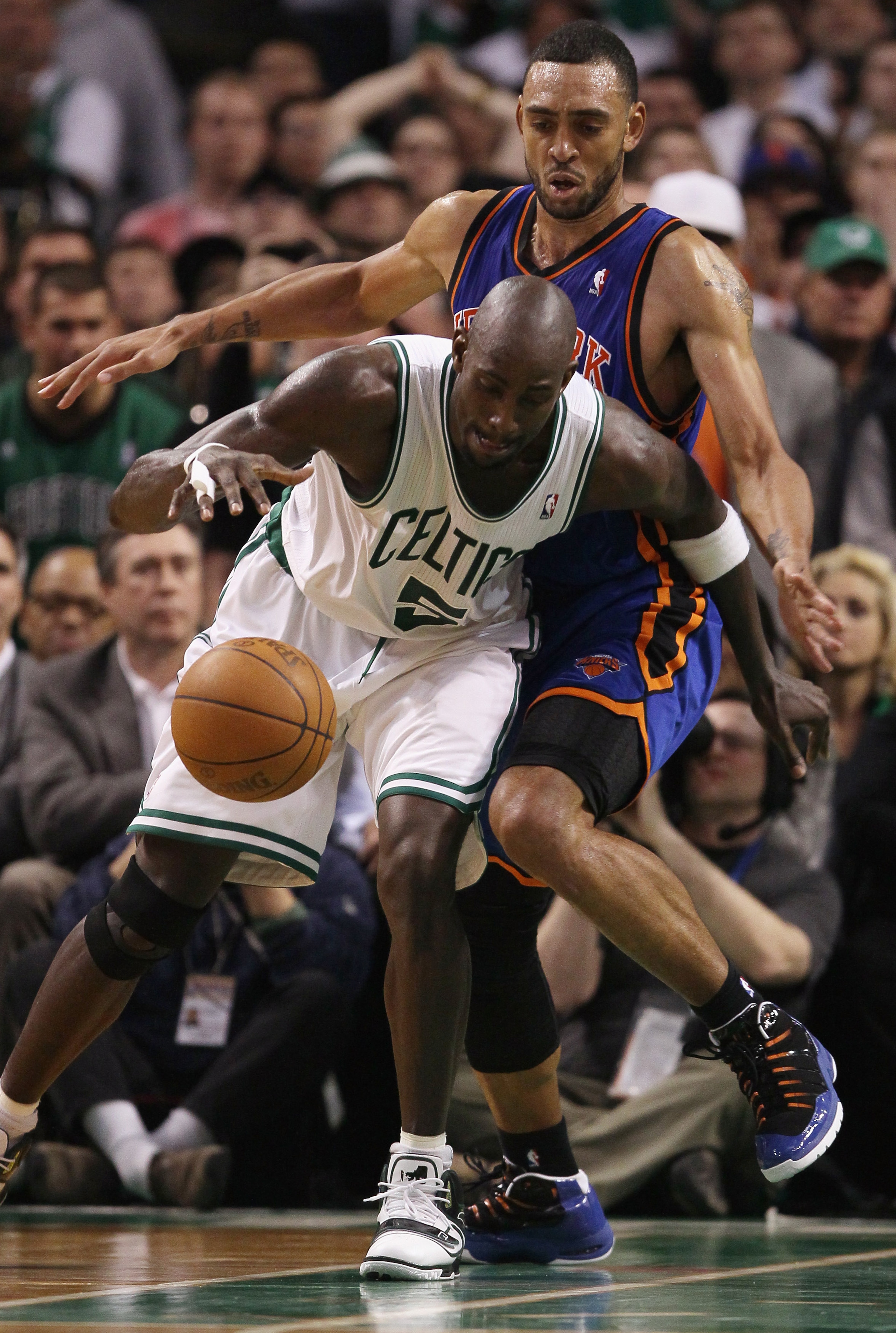 BOSTON, MA - APRIL 19:  Kevin Garnett #5 of the Boston Celtics heads for the basket around Jared Jeffries #9 of the New York Knicks  in Game Two of the Eastern Conference Quarterfinals in the 2011 NBA Playoffs on April 19, 2011 at the TD Garden in Boston,