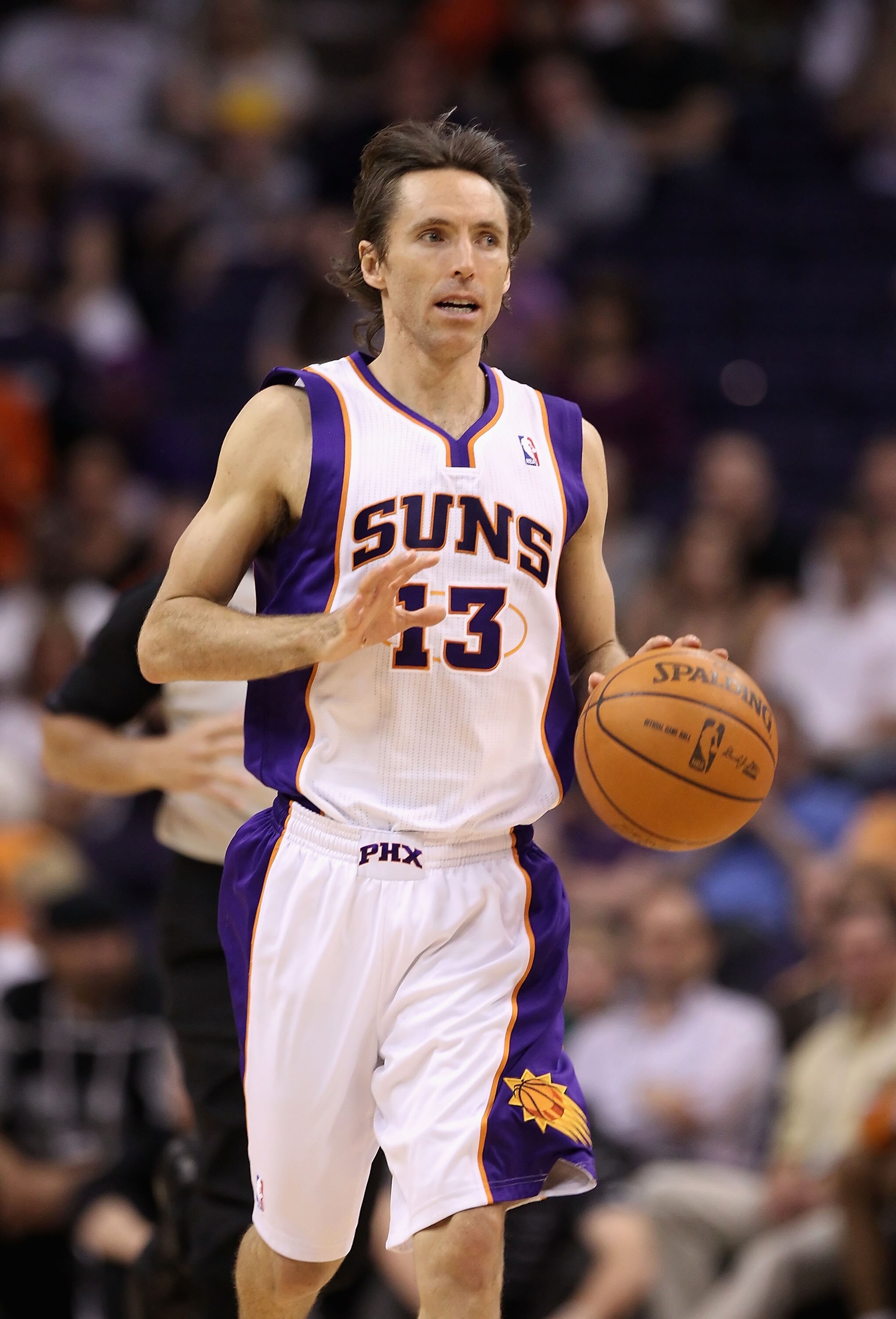 PHOENIX, AZ - MARCH 30:  Steve Nash #13 of the Phoenix Suns in action during the NBA game against the Oklahoma City Thunder at US Airways Center on March 30, 2011 in Phoenix, Arizona. The Thunder defeated the Suns 116-98.  NOTE TO USER: User expressly ack