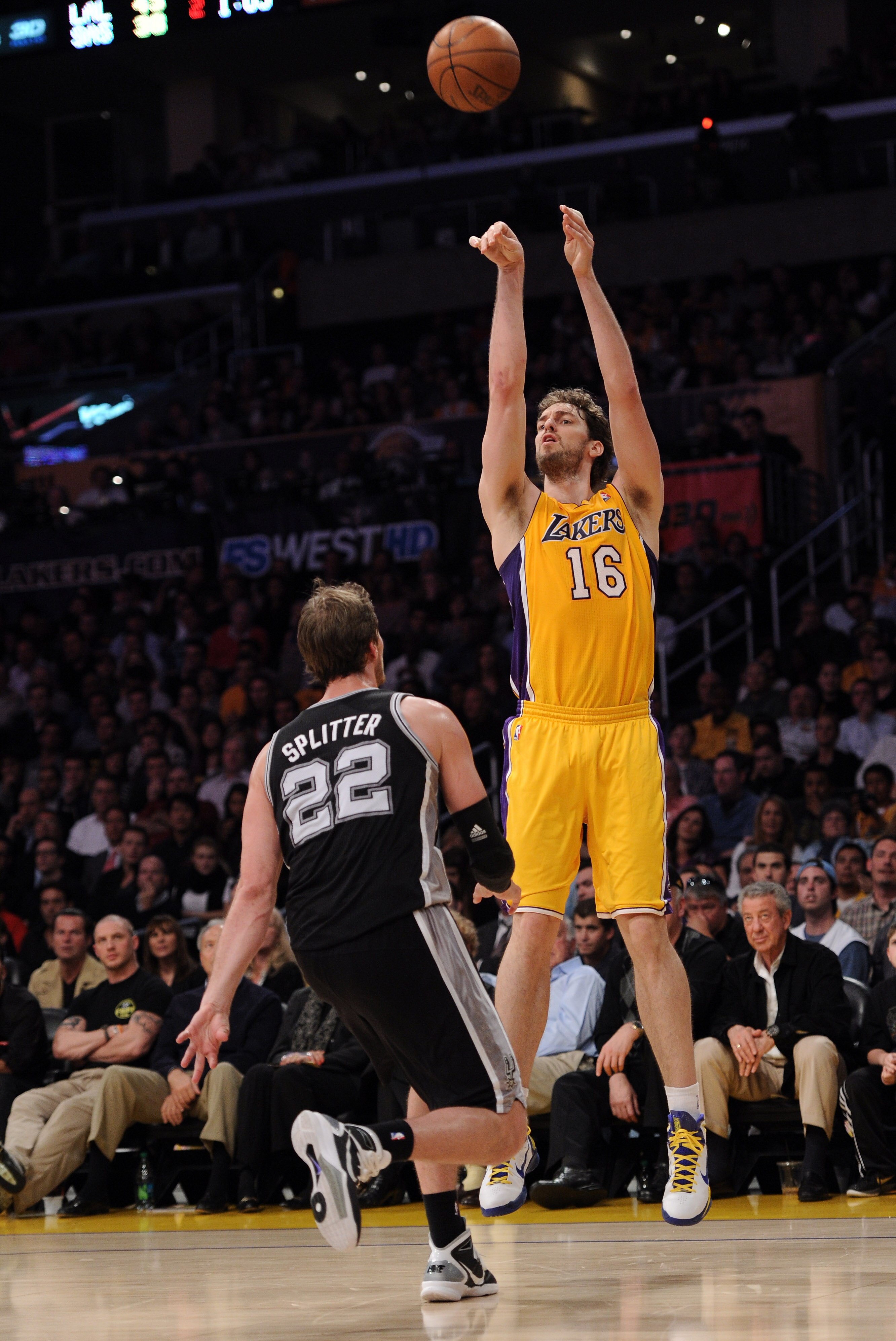 LOS ANGELES, CA - APRIL 12:  Pau Gasol #16 of the Los Angeles Lakers shoots a jumper over Tiago Splitter #22 of the San Antonio Spurs at Staples Center on April 12, 2011 in Los Angeles, California.  NOTE TO USER: User expressly acknowledges and agrees tha