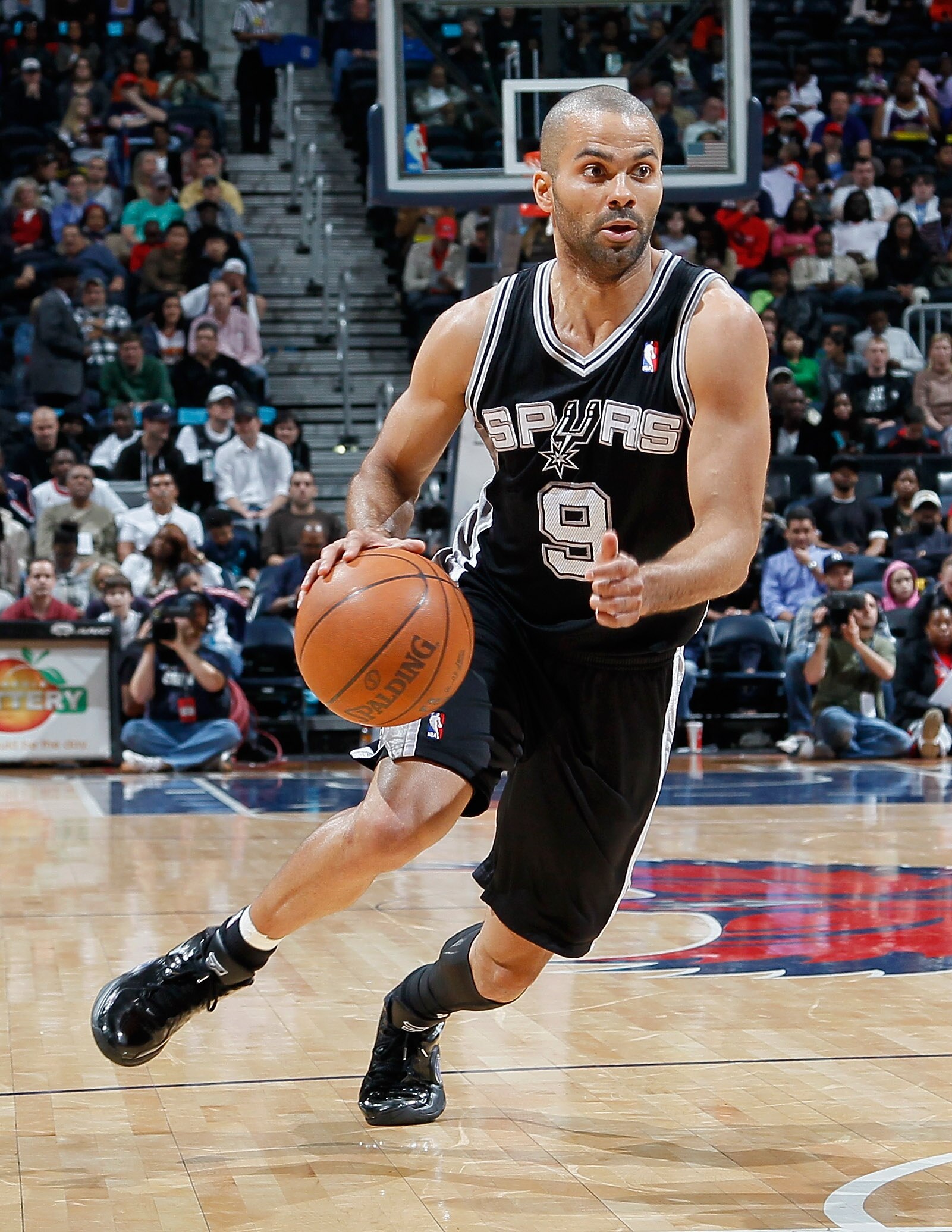 ATLANTA, GA - APRIL 05:  Tony Parker #9 of the San Antonio Spurs against the Atlanta Hawks at Philips Arena on April 5, 2011 in Atlanta, Georgia.  NOTE TO USER: User expressly acknowledges and agrees that, by downloading and/or using this Photograph, user