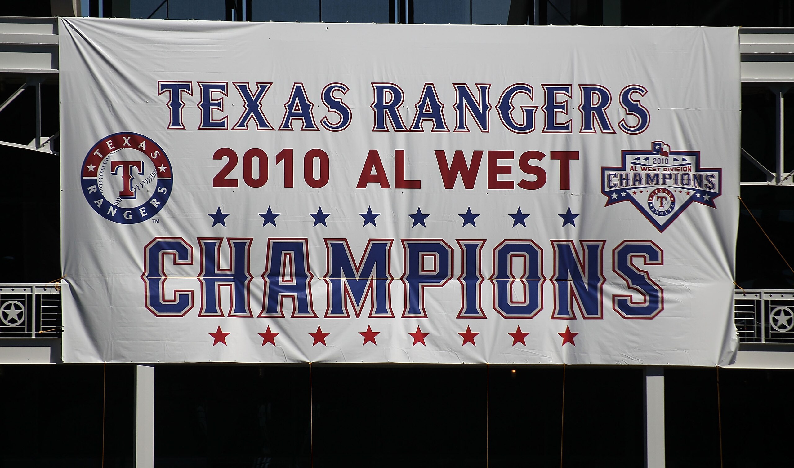 ARLINGTON, TX - SEPTEMBER 29:  A Texas Rangers AL West champions banner hangs at Rangers Ballpark in Arlington on September 29, 2010 in Arlington, Texas.  (Photo by Ronald Martinez/Getty Images)