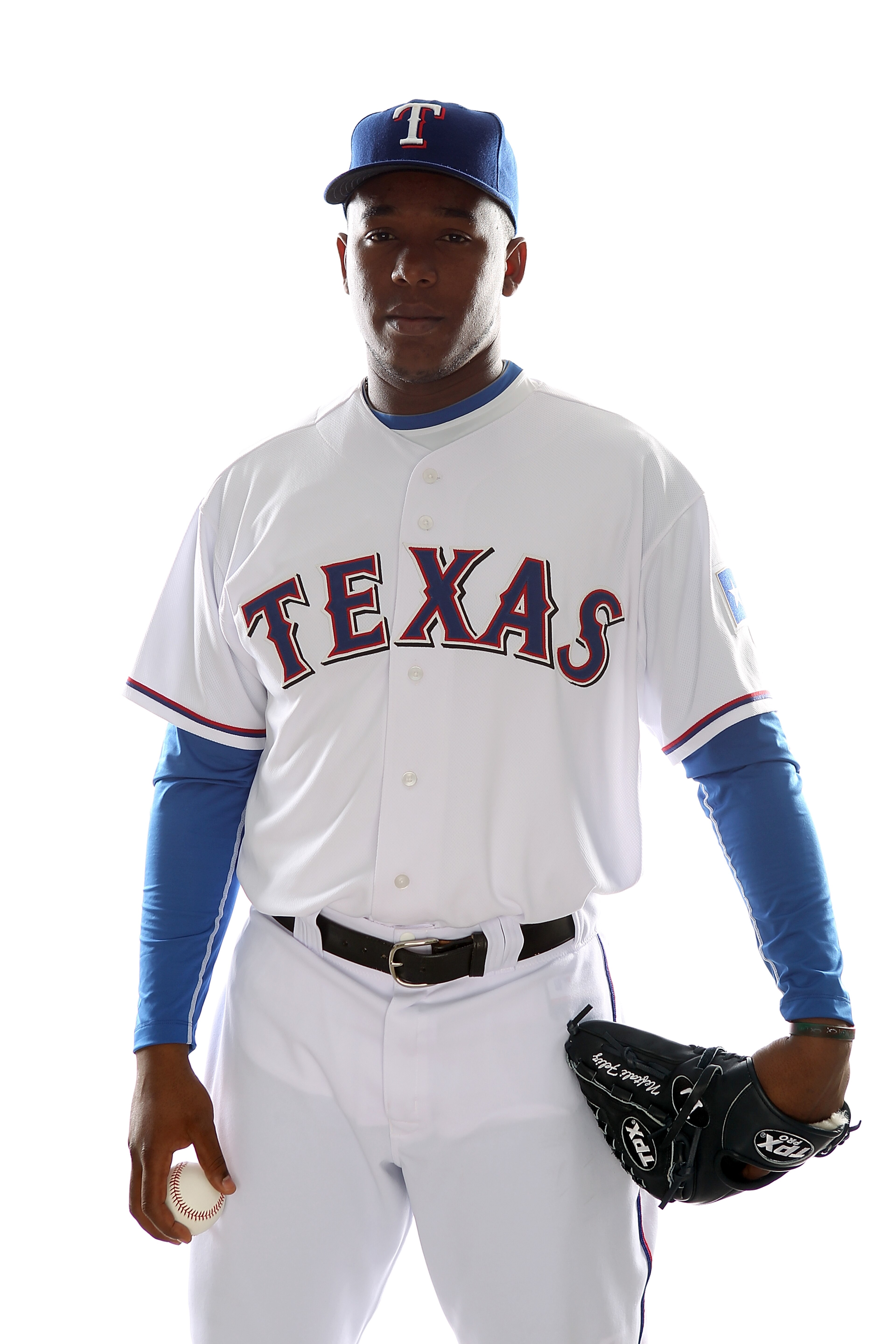 SURPRISE, AZ - FEBRUARY 25:  Neftali Feliz #30 of the Texas Rangers poses for a portrait during Spring Training Media Day on February 25, 2011 at Surprise Stadium in Surprise, Arizona.  (Photo by Jonathan Ferrey/Getty Images)