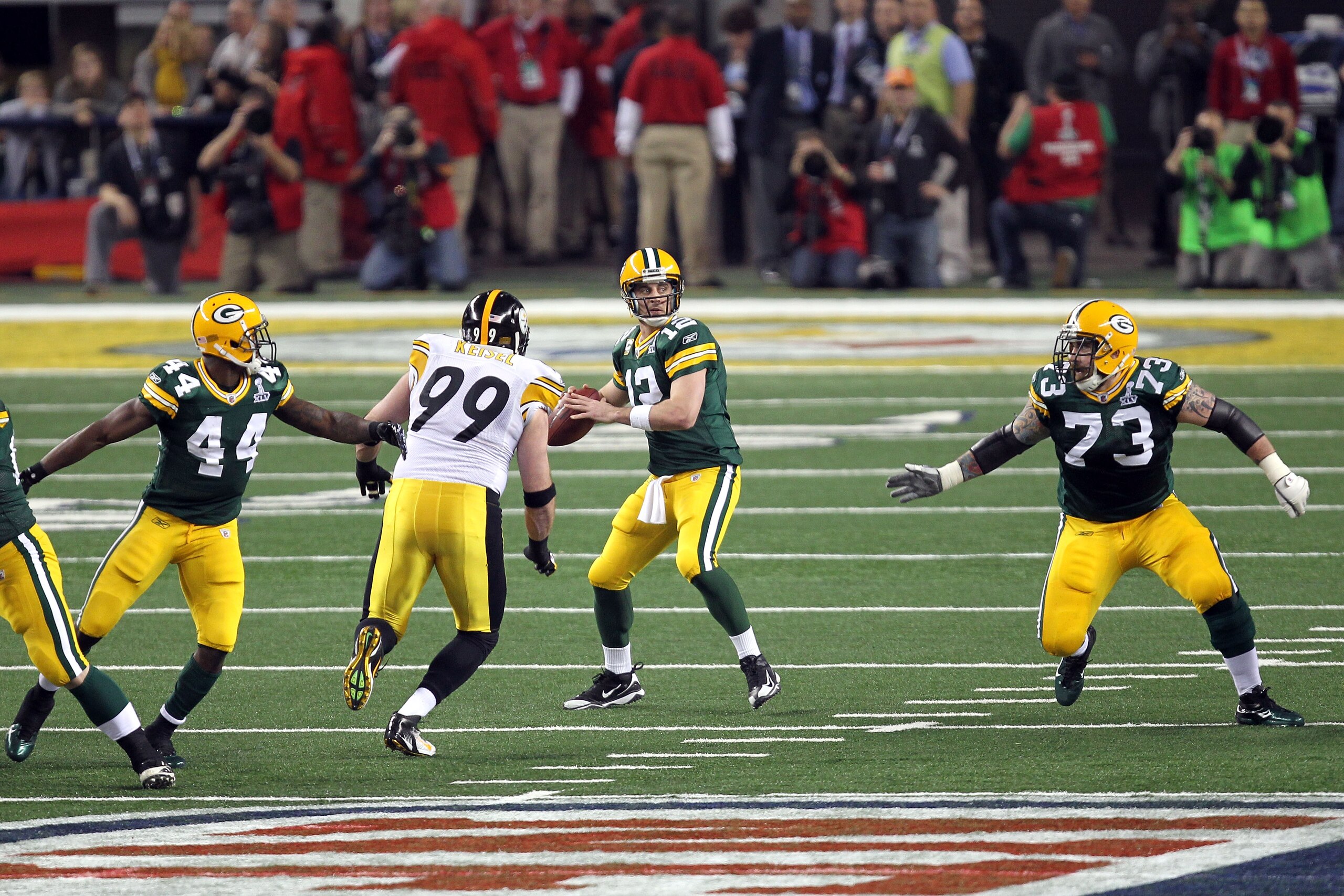 ARLINGTON, TX - FEBRUARY 06:  Aaron Rodgers #12 of the Green Bay Packers looks to pass against the Pittsburgh Steelers during Super Bowl XLV at Cowboys Stadium on February 6, 2011 in Arlington, Texas.  (Photo by Mike Ehrmann/Getty Images)