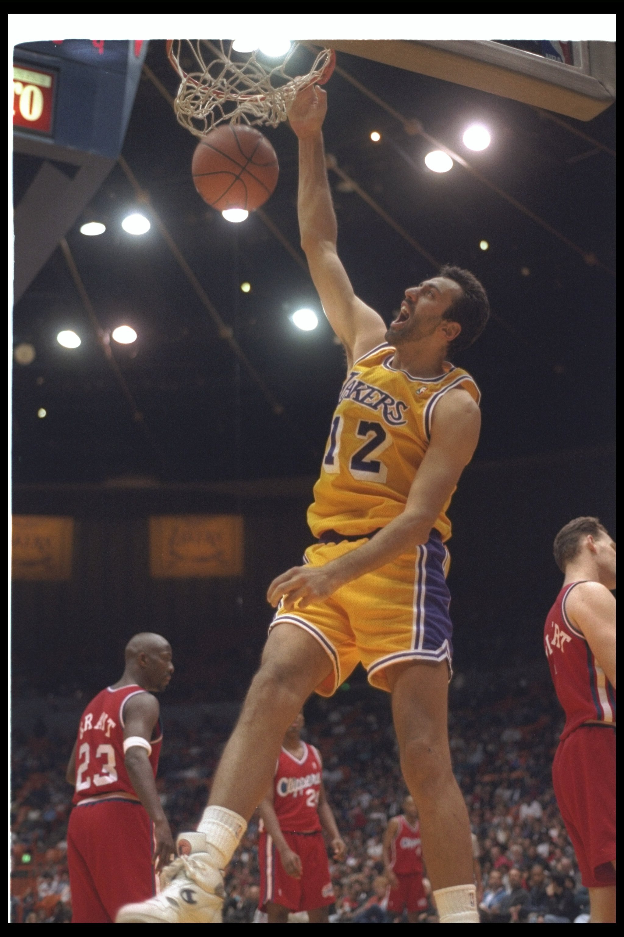 7 Jan 1994:  Center Vlade Divac of the Los Angeles Lakers sinks the ball during a game against the Los Angeles Clippers at the Great Western Forum in Inglewood, California.  The Lakers won the game, 111-108. Mandatory Credit: Stephen Dunn  /Allsport Manda