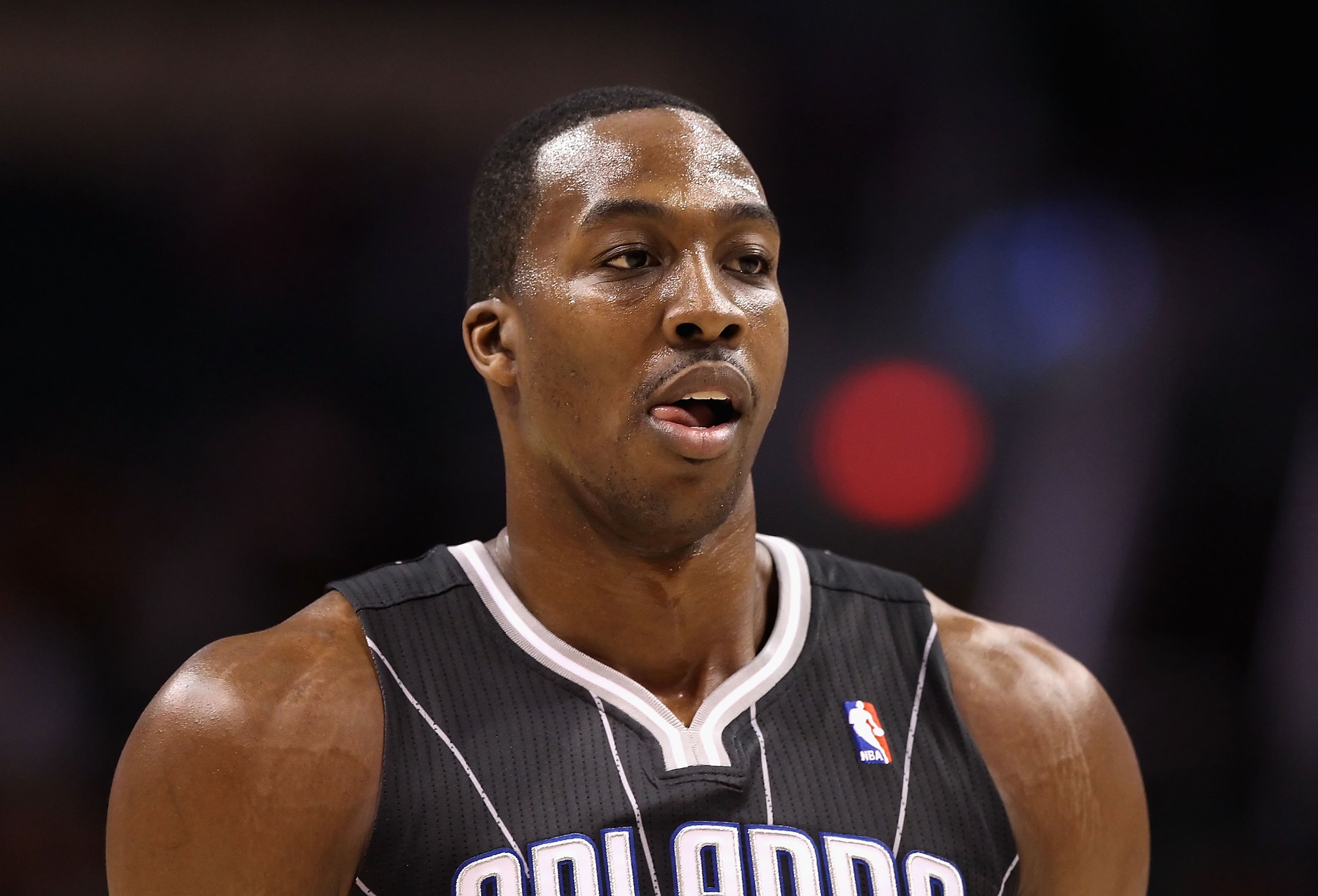 PHOENIX, AZ - MARCH 13: Dwight Howard #12 of the Orlando Magic during the NBA game against the Phoenix Suns at US Airways Center on March 13, 2011 in Phoenix, Arizona. The Magic defeated the Suns 111-88. NOTE TO USER: User expressly acknowledges and agre PHOENIX, AZ - MARCH 13: Dwight Howard #12 of the Orlando Magic during the NBA game against the Phoenix Suns at US Airways Center on March 13, 2011 in Phoenix, Arizona. The Magic defeated the Suns 111-88. NOTE TO USER: User expressly acknowledges and agre